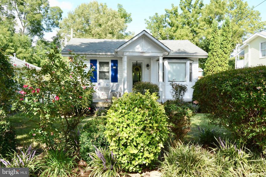 Exceptionally charming, single story home  ideally located just  blocks from the water, where you can launch your boat for a day of fishing or just exploring.  Live here full time or as your weekend escape for peace and quiet.  Bring the dog!  There is a beautifully fenced yard with a nicely kept storage shed.  Local park has a  large playground and pavilion.   Ride the ferry to Oxford for dinner or spend the day at the local beach.  Ideal for bikers.   Cathedral ceilings,  wood floors, open floor plan, granite countertop.  Updated bath and kitchen with SS appliances, RO water filter in kitchen.  This home is in excellent condition, move in ready.     It will not last long.