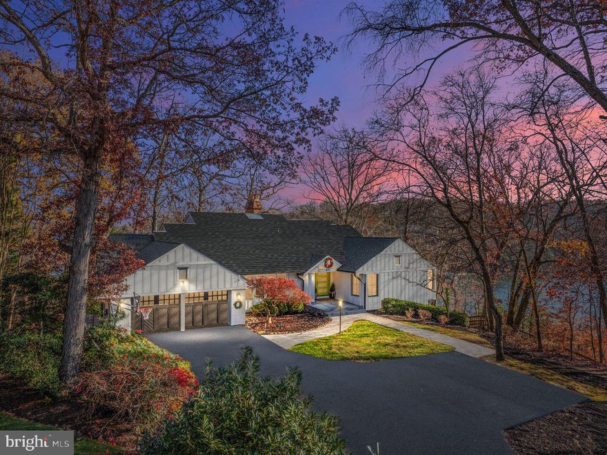 OPEN HOUSE CANCELLED! UNDER CONTRACT! Experience the ultimate in luxury living with this exquisite, custom built, waterfront property. Boasting incredible water views from almost every room, this home offers the perfect blend of elegance and comfort. Panoramic windows and sliding glass doors seamlessly connect the indoors to the outdoors.  All custom windows and doors are energy efficient and have a lifetime warranty. The open floor plan invites natural light to flood the spacious interiors, creating an airy, welcoming atmosphere. The chef's dream kitchen is a complete masterpiece, featuring a sleek, large marble waterfall island. These top-of-the-line high-end appliances are perfect for culinary enthusiasts. Enjoy cooking your favorite meals in your dual Lacanche range & oven. The custom built range hood will draw you in, and immerse you into this contemporary cooking space. There are expansive living and dining areas with panoramic water views. Luxurious finishes throughout, including hardwood floors and custom cabinetry. There is a main floor spa-like primary suite with extra large windows overlooking the water. Wake up everyday to the stunning views of Clements Creek & the Severn River! There are two additional ensuite bedrooms on this main level with renovated bathrooms and custom closets. Downstairs, you are greeted by walls of windows and doors to the beautiful waterfront!  There are two additional bedrooms and nicely finished bathroom with Toto toilet, heated floors, and a steam shower that heats up to 105 degrees Fahrenheit! The total square footage of this home is 6511. In addition, there is a custom built desk, wine cellar, and workout room in this lower level. The exterior of the home features new Hardie Wood siding on the front & just painted cedar wood on the back. There are multiple decks to enjoy the vast water views that wrap around to and down the private dock site.  There is 300 FEET of water front. There is a brand new lift that can handle 9000 lbs.  The deep water dock will allow boats up to and over 30 feet.  Other upgrades include new GAF timberline roof with lifetime warranty, new gutter system with built in leaf protection, brand new septic system, water system, new HEATED sidewalks to front door, and electric vehicle and charger hookup in garage.  The Downs on the Severn is a water access community with 2 marinas.  The marina at Clements Creek features floating docks and was recently redone in the spring of 2024.  There is a smaller marina at Brewer Creek with a ramp and trailer access. The Downs has a community pool with summer swim team and Tennis with Pickle Ball courts.  There are many scheduled socials for adults and kids at the community clubhouse! Don’t miss your chance to live in this exceptional waterfront home & community—schedule a viewing today!