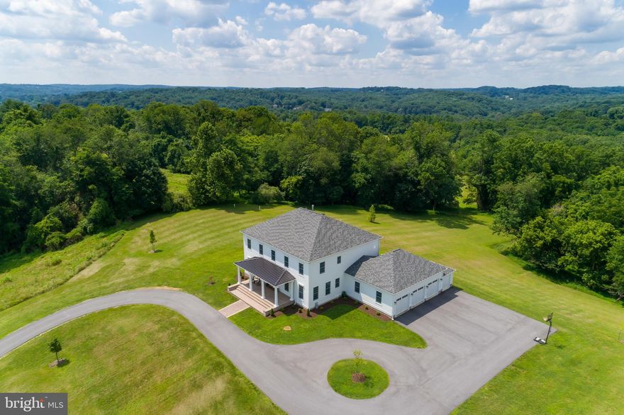 Impeccable three year custom home in prime Sparks location. Situated on a gorgeous 4.3 acre lot, this Georgian style beauty boasts over 4,200 square feet with 5 bedrooms and 4   baths. A gracious large front porch leads to a grand foyer & elegant living room with built-ins. The stunning kitchen with custom cabinets, exquisite quartzite counters, Wolf/Subzero appliances & wine fridge opens to a family room with fireplace, creating an expansive & functional open space buyers covet. The welcoming floorplan includes a first floor guest suite with private bath and an additional 4 bedrooms on the upper level. Three generous sized bedrooms   one with a private bath and two that share a Jack & Jill bath with double vanity. The luxurious master suite is a welcome retreat with a large walk-in closet & jaw dropping bath with double vanities, separate tub and large walk-in shower with striking tile details. Hardwood floors & recessed lights throughout. Zoned efficient geo-thermal HVAC system & tankless hot water heater. Three car garage. The well-appointed & high finishes throughout this home separate this from others   architectural crown moulding, floor to ceiling tile, exquisite light fixtures & much more. These details will wow the most discerning buyer. All of this in a most convenient locale minutes to the NCR trail & I-83 with easy access to Wegmans, Towson and more. Located in a highly desirable Blue Ribbon school district.