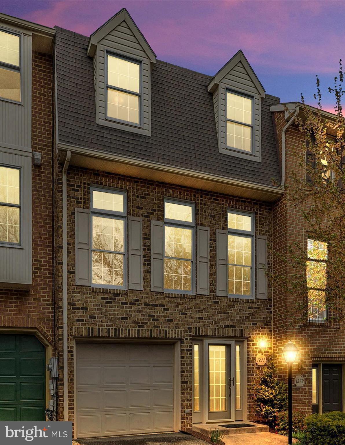 Immaculate well-cared for 3-level townhome with gleaming wood floors, 9 foot ceilings in the finished basement and second floor living room. Park your car securely in the garage and enter the lower level with a unique floor plan with a family room with 9 foot ceiling, gas fireplace, 1/2 bath and extra storage closets. Rear walk-out to the patio and backyard. Enter the second level and enjoy the living room with 9 foot ceilings, custom crown molding and lots of natural sunlight. Have breakfast in the eat-in kitchen with granite countertops or use the dining room to entertain guests. Enjoy time on the deck that can be used for grilling and entertaining. The third level has plenty of room with 3 bedrooms and 2 full baths. Master bath has a tile floor, separate shower and soaking tub. Master bedroom has a walk-in closet. The seller just installed a new hot water heater April 2024. Community amenities include out-door pool, tennis courts, tot lots, community center and walking paths! Hurry won't last long!