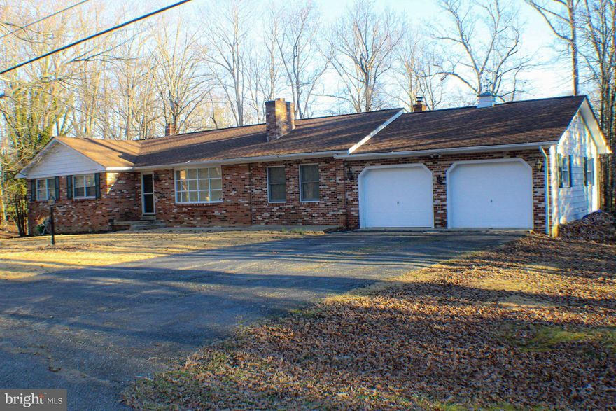 Almost all brick rambler with nearly 1700sqft on the main level.  This 3 bedroom, 2 full bath home has hardwood throughout the main level.  Featuring a family room, kitchen, separate dining room and a large bonus room.  Hall bath was just recently updated.   Bonus room off dining room is a great addition when entertaining.  It also has a free standing wood burning fireplace.   Lots of possibilities with a full basement which has been partially finished.  Possible 4th bedroom with walk-in closet, huge rec area with wood stove insert and a separate laundry room.  2 car attached garage with a pellet stove and 2 sheds for additional storage.  All situated on nearly an acre of land.