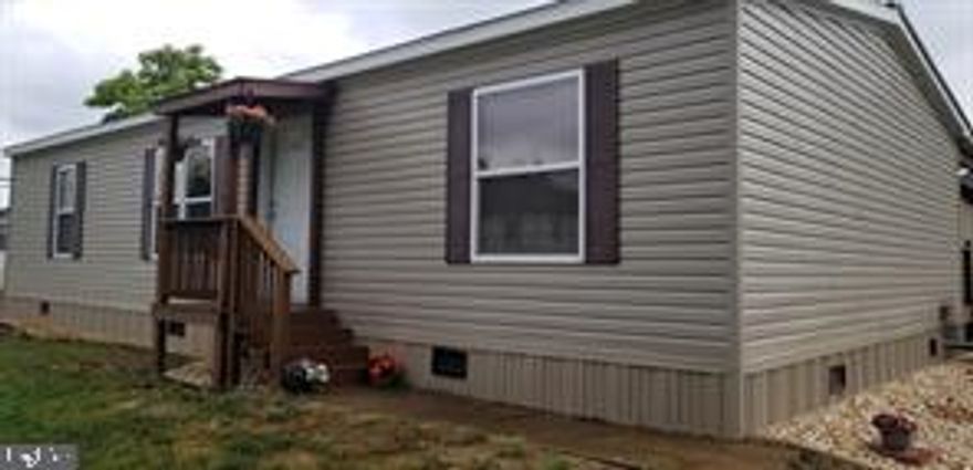 Motivated Seller has priced this gem below appraisal.  Must see to appreciate all this property has to offer.  Nicely maintained 3 bed/2.5 bath with additional 12 by 11.5 bonus room that could be used as a 4th bedroom, home office or craft room.   House features spacious country kitchen, split floor plan, and huge attached garage with a pellet stove, 400 Amp service, 200 Garage/200 House. Concrete floor and oversized bay doors on both sides of garage, paved driveway, large storage room, office space and workshop! Great for a residence, business or both!  Located just 8 miles from Romney. Store and elementary school within walking distance.  This is a must see, call for your appointment today!