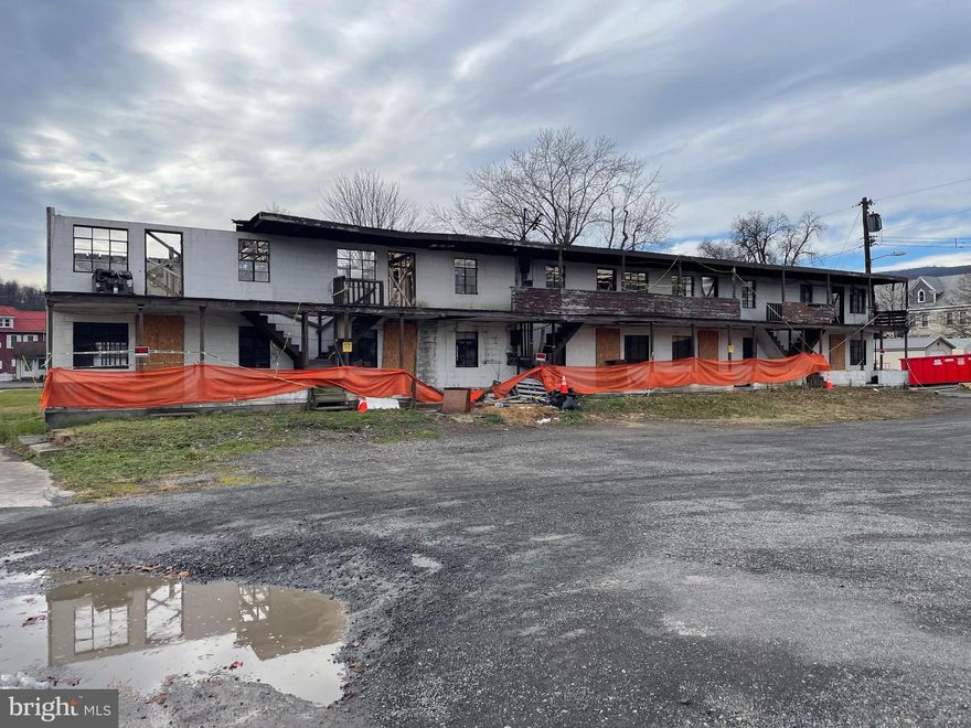 Located in the heart of downtown Keyser, this property offers great potential for various uses such as an apartment building, storage unit, office space, and more. The lot is large and level and is connected to public water and sewer systems. Listed at under 70,000 this property is ready for you and your imagination!