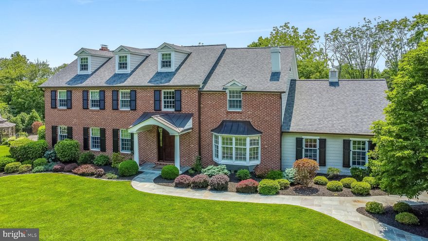 5-Star Resort-like amenities await at this captivating, completely renovated and updated, 5-bedroom 3.5 bath Blue Bell Beauty with over 5200 sq ft, within an enclave of 5 custom homes accessed by a private lane on a picturesque 2.3 acre fully fenced lot with saltwater pool, tennis court, Pole Barn and 18th century Spring House. The brick-pillared driveway entrance faces the private lane & leads to a flagstone walkway and covered flagstone front porch. The 3-story Colonial exterior features a brick façade with newer Hardi-plank siding, newer windows (2014) and new roof (2019). Hardwood floors in every room, custom millwork and excellent upgrades will excite even the most discerning buyer. The formal Dining & Living Rooms feature custom millwork, and pocket French doors from the Living Room open to the spacious Office. The Office flows to the Family Room with wood-burning fireplace surrounded by a brick floor-to-ceiling wall & wood mantel. The completely renovated Gourmet Kitchen (2014) offers marble counters, 42" cabinets, center island with butcher block counter and seating for 3, stainless appliances including built-in Viking refrigerator, Viking gas stove with stainless hood, Miele dishwasher and microwave, decorative glass cabinetry and under-cabinet lighting. The Breakfast Room provides French doors opening to the exciting 4-season Sun Room with its own HVAC system, spanning the width of the house. Walls of French doors with screens surround the entire room and a door from this room opens to an exterior flagstone Patio.  A turned hardwood staircase leads to the 2nd Floor. A library of custom bookshelves borders the staircase wall. The luxurious Primary Suite features a stunning Sitting Room with 2nd wood-burning fireplace opening to the spacious Bedroom. An incredible walk-in closet is professionally organized. The totally renovated, gorgeous Main Bath (2014) offers a tiled floor, marble counters with 2 porcelain sinks, soaking tub & oversized spa shower with rainhead shower head, bench seat and frameless glass door. French doors from the Bedroom lead to a maintenance-free Deck overlooking the breathtaking grounds. 2 very spacious bedrooms with professionally organized closets, and a completely updated Full Bath w/marble counter, double sinks and soaking tub with shower complete the 2nd floor. Hardwood stairs provide access to the 3rd Floor featuring 2 additional fantastic bedrooms sharing an updated Full Bath. The Garage is currently configured for 2 cars but has 3 automatic doors; the middle bay is currently used as a mudroom, however a buyer could remove the walls to recreate the 3rd bay. The exterior grounds are beyond breathtaking. Sip a glass of iced tea in the Gazebo overlooking the sparkling, resurfaced, fenced Saltwater Pool. Play tennis on the resurfaced court, or enjoy a game of basketball on the same court, while friends watch from the adjacent trellised Patio. Roast marshmallows at the Fire Pit. Grow your own vegetables in the garden. Additional cars can be stored in the Pole Barn, or this could be the perfect location for a workshop, Gym or Studio. A charming 18th century stone Spring House further enhances the view, accompanied by a nearby meandering stream w/low stone walls. Additional excellent features include 4 zones of HVAC (2 replaced in 2015, 1 added in 2015)); backup Generator (2019), 2 tankless hot water heaters, all new inside doors, Central Vac, Security System, Bilco doors in the basement and a complete basement drainage system w/sump pump added in 2019, connected to the backup generator. Located within highly rated Wissahickon School District, Bell Bell has consistently been ranked as one of the best places to live in the Phila suburbs.  Minutes to all major routes and public transportation providing easy access to center city; minutes to Whole Foods and other great shopping and restaurants including in the nearby town of Ambler. Multiple parks and trails are also close by. Tennis anyone?
