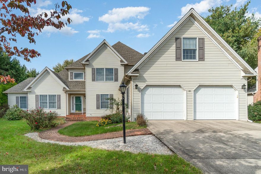 Discover timeless charm and modern comfort in this stately two-story home, beautifully situated on a mature, tree-lined lot within the coveted Logan Downs neighborhood. Spanning over 2,800 sq. ft., this residence offers a thoughtfully crafted contemporary floor plan designed to impress. Step inside to an open and airy layout where vaulted ceilings crown the spacious living room, and trey ceilings add a touch of elegance to the dining room. The recessed family room flows seamlessly into a spacious, functional kitchen with central island and breakfast nook, ideal for everything from weeknight dinners to hosting gatherings. The main level features an optional bedroom and full bath, plus a laundry room—perfect for guests or flexible living arrangements. Upstairs, the second story offers three well-sized bedrooms, including an impressive primary suite complete with a walk-in closet and private full bath. An office and an additional hall bath provide extra space for work or leisure. Additional highlights include a full, unfinished basement offering endless possibilities, a two-car garage, and a lovely rear deck overlooking the tranquil backyard—a perfect retreat for outdoor relaxation. This home combines space, style, and versatility in one of the area’s most desirable neighborhoods. Don’t miss your chance to make it yours—schedule your tour today!
