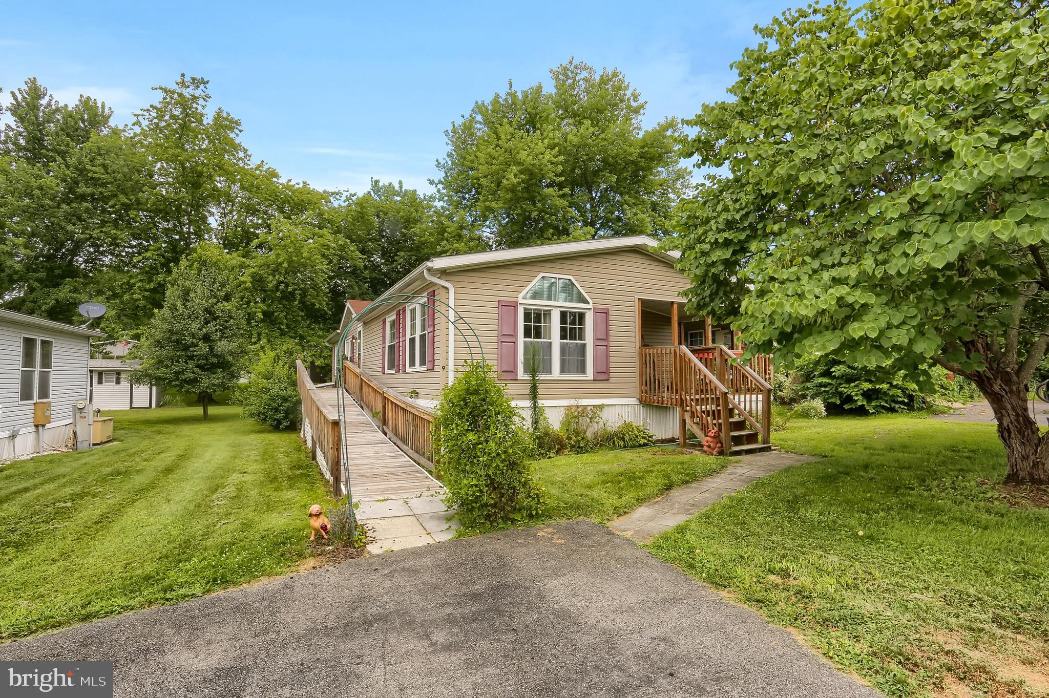Welcome home to this expansive, well-laid out Ranch home in Midland Park. This home has had custom upgrades done for easy one floor living which includes accessibility inside and out with a renovated main bath with walk-in shower and full outside ramp to main door entrance. The home features 3 bedrooms, with large main bed with on-suite main bath, with 2 bedrooms on other end, giving appeal of separation and more privacy, a central living room, an open bright kitchen and dining room with sliders to the front porch, and a separated laundry room/mudroom tucked in off from the front entry door off the front porch. Home has new windows, forced hot air propane heat with separate central air and added piece of mind with a backup Generac Generator just recently installed. Make and Model of Mobile Home is 2000 Skyline and title on file. Large 10x16 garden shed and mature trees/bushes help to shade the lot and provide nice landscaping. Call today to learn more and set up a private showing.