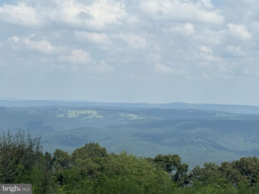 Rare offering!  Beautiful corner lot in coveted High Mountain Orchard.  Flat, clear build site opens up to a breathtaking panorama.  Act now before it's gone!