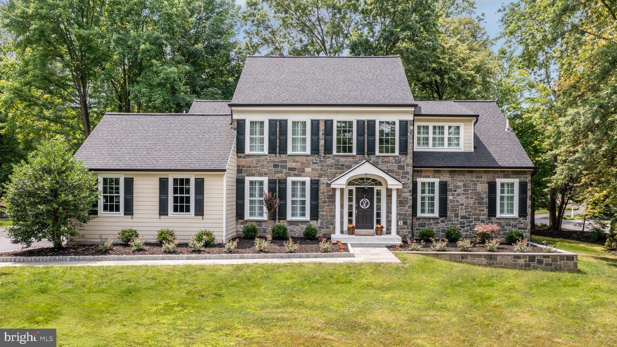 Don’t miss this stunning 4 BD, 3/1 BA colonial in sought-after Wayne! Over $241,000 in recent renovations including new natural stone and HardiePlank cement board cladding, new windows, new roof (incl. fascia & soffits), new flooring, interior painting, new gutters, new light fixtures, and new Lennox 3-zone HVAC system. Professionally re-landscaped with a brand new stone garden wall and Belgian-block-edged flagstone walkway to the front porch. Soaring Entrance Hall opens to large Dining Room and 2-story Living Room with fireplace. The updated gourmet Kitchen has white cabinets, glass ribbon tile backsplash, quartz counters, and stainless appliances including 5-burner gas cooktop with exhaust hood. Popular open concept floor plan with views from the Kitchen across the large island (with barstool seating ledge and under-counter beverage/wine refrigerator) to the vaulted Family Room. The adjacent Breakfast Area has room for a large table and offers great views of the side yard. The Family Room has a gas fireplace, built-ins, and opens to the 2-tiered travertine patio, with separate areas for dining and relaxing. The main floor is completed by a Half BA, and a Mudroom/Laundry Room with doors to the 2-Car Garage and the flagstone covered side porch. Unique, custom floor plan includes a 1st floor Primary Bedroom suite with new wide-plank, engineered wood floors, 2 walk-in closets, and a renovated en suite Full Bathroom. The totally renovated, spa-like Bath features a double vanity with Carrera marble counters, Kohler fixtures, glass-enclosed shower stall, and a deep, free-standing soaking tub. The flexible floor plan also features an upstairs 2nd Bedroom with a private, en suite full Bath, large closet, and a spacious sitting area. Bedrooms 3 and 4 share a large Hall BA with tub/shower combo. All the upstairs bedrooms feature fresh paint and new carpet. Downstairs is a spacious Recreation Room with fresh paint, new carpet, and a very large unfinished Utility/Storage Room which offers great space for finishing into add’l living space if desired. The beautifully landscaped property is in the heart of the popular Treyburn community, which has scenic private walking paths and stately specimen plantings… because the site used to be a tree nursery! Located within walking distance of the Chester Valley Trail, and in the renowned Tredyffrin Easttown school district, this property is also convenient to shopping, restaurants, major transportation routes, corporate centers, Center City, train stations, and Philadelphia International Airport.