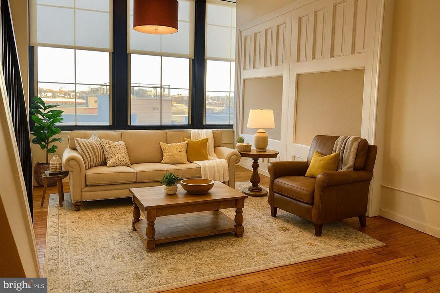 Welcome to Hawthorne Lofts, one of the best condominium buildings in Center City. Nestled in the heart of the Hawthorne neighborhood. This is a RARE opportunity to own this one-of-a-kind, top floor, DOUBLE UNIT converted into one huge 1900 sq ft, beautiful, light-filled space with gated PARKING. This bi-level unit has 3 bedrooms, 2 bathrooms, a den/flex space that could easily be converted into a bedroom. The first floor has HARDWOOD FLOORS and 10 ft windows that line the wall of your living space. Character exudes from every nook in this amazing space with built-in features such as original chalkboards, shelving, desk, and built-ins. The open space of the first floor seamlessly invites all activities from cooking in this open kitchen with STAILESS STEEL appliances flowing into a huge space for dining and living area for entertaining and relaxing.  For added convenience, there is a bedroom, a den, two full bathrooms, and additional storage space on this level. Upstairs find additional 2 bedrooms, more closets, and enjoy extra ceiling height that the top level affords. Located in the Historic Hawthorne Lofts, enjoy numerous AMENTITIES including: a light-filled well-equipped GYM, SAUNA and STEAM ROOMS, common room with billiards table and MEDIA CENTER, YOGA STUDIO, along with access to a massive community ROOF DECK with 360 views of the City, and a FREE laundry room. HARDWOOD floors throughout and the impeccable condition of the building with a newly refinished lobby complete with hardwood floors and fresh paint makes this the perfect space to call home. Conveniently located within a five-minute walk to Whole Foods, CVS, Acme, Hawthorne's Cafe, the Italian Market, Hawthorne Community Garden, as well as close-by SEPTA and Indego Bikes.