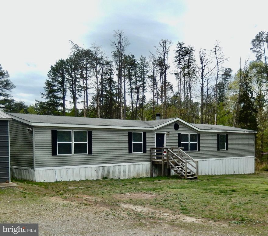 Large rambler located near Lake Anna and about 30 Minutes from Fredericksburg. Home needs some TLC but has great square footage and on a large lot with detached garage with full electric. Split floor plan allows for privacy for the primary suite. Double sided Wood burning Fireplace between living and family room. Nearly 2000 square feet of living space. Both AC and well pump have been replaced in the past couple of years.