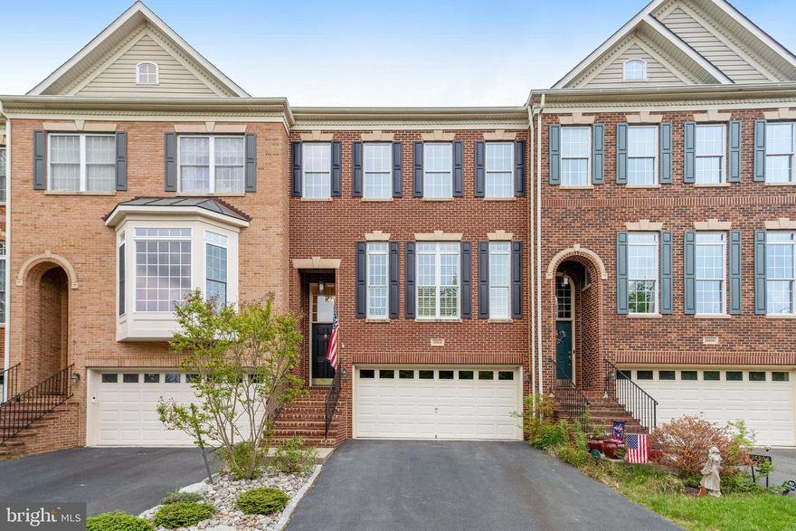 ** Offers are due no later than Monday April 28 at noon.  The seller reserves the right to accept an offer earlier than the deadline.

Welcome to 25804 Commons Square, a bright and beautifully maintained brick townhome located in the heart of the sought-after South Riding community in Chantilly, Virginia. This spacious 3-bedroom, 3.5-bathroom home with a 2-car garage offers the perfect blend of comfort, style, and convenience.

With easy access to Dulles International Airport and the Dulles Technology Corridor, this home is situated in the South Village section of South Riding and is near neighborhood amenities including a community pool, tennis courts, and playground.  The South Riding HOA offers residents access to four outdoor pools, ten playgrounds, four tennis courts, a pickleball court, and miles of scenic trails. It’s also just minutes from the Dulles South Recreation and Community Center, which features an indoor pool, lazy river, fitness center, basketball court, and rock-climbing wall.

Inside, the main level boasts beautiful hardwood floors, crown moldings, recessed lighting, and 9-foot ceilings that create a warm and open feel. The gourmet kitchen features granite countertops, a large center island, a double wall oven, a gas cooktop, and abundant cabinetry, making it ideal for both everyday living and entertaining. The adjacent breakfast/family room opens to the kitchen, providing a seamless space to relax or gather.  Open living and dining rooms complete the main level.

Upstairs, new carpeting and recessed lighting enhance the comfort level. The primary bedroom is a peaceful retreat with vaulted ceilings, a walk-in closet, and an ensuite bathroom that includes a Jacuzzi tub and a separate shower. Two additional bedrooms also feature vaulted ceilings and share a well-appointed hall bathroom with a dual sink vanity. 

The lower level offers a recreation room complete with a gas fireplace and access to the fully fenced backyard—perfect for indoor-outdoor living. A two-car garage provides additional storage space, and the driveway plus additional guest parking out front ensures plenty of room for visitors.