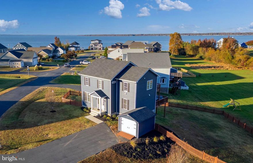 **Interior photos coming soon**Welcome to your dream home in the highly sought-after community of Potomac Landing! This impressive, custom-built gem, recently built in 2021 by Heeman Construction, offers an unbeatable blend of modern floorplan and relaxed riverfront living. Imagine enjoying year-round  views of the breathtaking Potomac River, cruising over to Tim’s Rivershore on your golf cart for a waterfront meal, or unwinding at the serene community beach. The exterior boasts durable cement fiber siding, expansive double decks ideal for entertaining, a generous corner lot with a fully fenced backyard, and fresh, thoughtfully designed landscaping. Step inside and you’ll be greeted by an open, light-drenched floor plan, complete with luxury vinyl plank flooring throughout and crisp craftsman-style trim. The spacious living room seamlessly combines comfort and sophistication, featuring custom built-ins and a  shiplap-wrapped fireplace. The main level also includes a versatile flex space, currently styled as a formal dining room but easily adaptable as a home office or cozy den. The kitchen is a true culinary haven, equipped with elegant white shaker cabinets, gleaming quartz countertops, an oversized island, sleek stainless steel appliances, a custom backsplash, and a generously sized pantry. Downstairs, the recently finished basement offers a sprawling rec room that provides endless possibilities—perfect for game nights, movie marathons, or additional living space to accommodate your growing family. Upstairs, you’ll discover four spacious bedrooms and two well-appointed full bathrooms. The primary suite is a true retreat, featuring a luxurious en-suite bathroom with a relaxing garden tub, separate shower, double vanities, and a walk-in closet. Best of all, you have your own private deck off the master, offering stunning water views to start or end your day in tranquility. Don’t miss your chance to experience the ultimate Rivah lifestyle in Potomac Landing—this home is a rare find!
*Owner is agent*