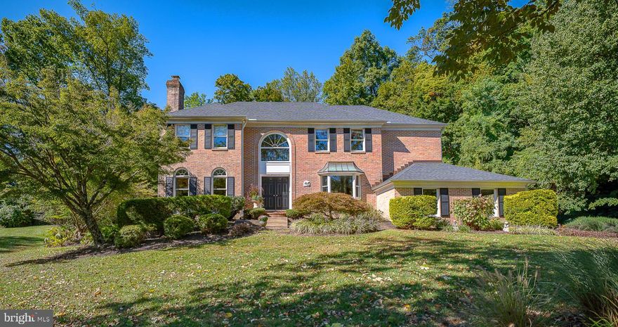 Tucked away on a quiet cul-de-sac in the highly sought-after Ithan Elementary catchment, this meticulously maintained 4-bedroom, 3 full and 1 half-bath Colonial offers the perfect blend of classic charm and contemporary upgrades. With 3,500 sq ft of thoughtfully designed living space plus a fully finished walk-out basement featuring sprawling recreational space, full bath and generous storage, this home is a rare Main Line retreat. Step into the two story grand foyer and experience a layout crafted for both everyday living and effortless entertaining. The formal dining room features a large picture window that frames serene views of the manicured grounds, offering an elegant setting for dinners and celebrations. The large formal living room impresses with its cozy fireplace and has direct access to a stylish bar area complete with a built-in kegerator and beverage center, ideal for hosting or unwinding right off the family room. At the heart of the home lies the beautifully renovated kitchen, outfitted with custom Kountry Kraft cabinetry, stainless steel appliances, an oversized eat-in peninsula and is complete with a dedicated workstation. The kitchen opens seamlessly to a bright and airy breakfast room with a picturesque window overlooking the manicured landscaping and private terrace. The eat-in area flows into a spacious family room with custom built-ins, a gas fireplace, and sliding glass doors with access to the expansive brick terrace and back yard. Step outside to your own private sanctuary with a sprawling terrace surrounded by a handsome brick privacy wall and extensive professional landscaping. This incredible outdoor space is perfect for entertaining, grilling, dining al fresco, or simply relaxing in the peaceful, garden-like setting. With mature plantings and lush greenery providing year-round beauty and privacy, it’s a true extension of the living space. Upstairs, the luxurious primary suite offers a true sanctuary with vaulted ceilings, a peaceful sitting area with floor-to-ceiling built-ins, an en suite bathroom featuring dual vanities, a soaking tub, water closet, standing shower, and a large walk-in closet with attic access. Three additional generous bedrooms, all similar in size, feature custom closets and share a well-appointed hall bath with double vanity and tub/shower combo behind sliding glass doors. Additional highlights include a 3-car attached garage, a functional mudroom and laundry room off the garage entry, surround sound throughout the home, and expansive windows that flood every room with natural light and sweeping views. Conveniently located just minutes from top-rated Radnor Township and Main Lines most prestigious private and public schools, parks, walking trails train station, boutique shopping and quality dining in Bryn Mawr, Garrett Hill and close-by Newtown Square, this exceptional home combines timeless design, thoughtful updates, and an unbeatable location, a true gem in Radnor Township.