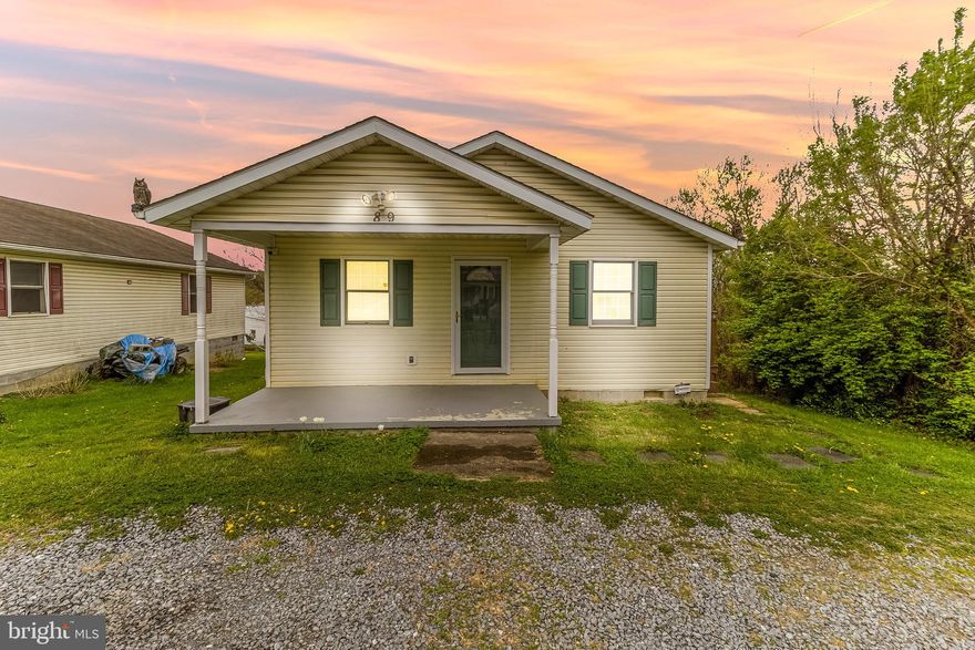 Welcome to 89 State Circle — a 2-bedroom, 1 full and 1 half bath ranch-style home in Martinsburg, where one-level living and a well-balanced layout come together with a sense of ease that’s felt the moment you step inside.

Inside, the home opens into a bright, straightforward layout that flows easily from the living space into the kitchen and dining area. The kitchen brings together granite countertops, stainless steel appliances, and generous cabinetry—simple, functional, and easy to live in. LVP flooring runs throughout the main living areas, creating a cohesive, low-maintenance foundation.

Both bedrooms are comfortably sized and set along the main level, offering a sense of separation from the living spaces while still keeping everything easily accessible. The full bath is centrally located, while the additional half bath adds everyday convenience in just the right place. The layout is efficient without feeling tight—everything is where you want it, nothing where you don’t.

Step outside and the home continues to open up. A rear and side deck extend your living space outdoors, creating room to relax, entertain, or simply enjoy a quiet evening. The front porch adds a welcoming first impression and a natural place to start and end your day.

Located in Martinsburg, you’re just minutes from everyday essentials including grocery stores, restaurants, and shopping along Foxcroft Avenue and the surrounding retail corridor, with quick access to Route 9 and I-81 for commuting. The MARC train from Martinsburg Station provides a direct option into Northern Virginia and Washington, D.C., adding another layer of convenience for those on the go.

It’s a home that keeps things simple in the best way—easy to maintain, easy to move through, and easy to settle into without needing to change a thing.