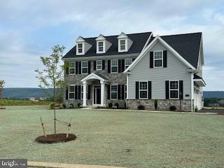 Welcome to Laurel Hills, a picturesque enclave nestled at the base of scenic Tussey Mountain, where elegance meets tranquility—just minutes from Penn State University. Presented by Foxlane Homes, this move-in ready luxury home offers an exclusive opportunity to own in one of Happy Valley’s most beautiful neighborhoods.
With close proximity to historic Boalsburg, the vibrant Penn State campus, downtown State College, and a wide array of shopping, dining, and entertainment options, Laurel Hills offers a lifestyle of convenience.
Inside, you’ll find a thoughtfully designed floorplan featuring a Chef’s kitchen open to the great room, spacious Owner’s suite complete with a huge walk-in closet and a spa-like bath that boasts a soaking tub and walk-in shower—a true private retreat. The large second-floor laundry room adds everyday ease, while the expansive covered rear patio is perfect for relaxing or entertaining outdoors.
The home also includes a handsome wide walkout from the sliding glass doors in the basement, offering abundant natural light and future potential for even more living space.
This is more than just a home—it’s a lifestyle. A must-see property for anyone seeking refined comfort and timeless quality in the heart of Central Pennsylvania. Showings begin 7/21/2025
