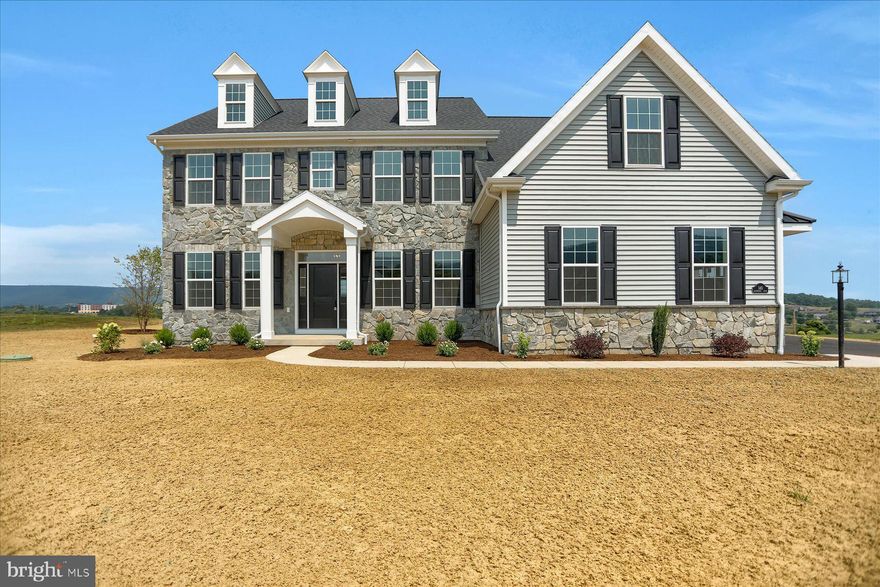 Experience living at Laurel Hills — a picturesque enclave nestled at the foot of scenic Tussey Mountain, where elegance and tranquility come together just minutes from Penn State University.
Presented by Foxlane Homes, this move-in ready luxury residence offers an exclusive opportunity to call one of Happy Valley home. Perfectly positioned near historic Boalsburg, the vibrant Penn State campus, downtown State College, and an array of premier shopping, dining, and entertainment, Laurel Hills blends convenience with serenity.
Step inside to discover a beautifully designed floor plan that seamlessly combines comfort and sophistication. The Chef’s kitchen opens to a bright, inviting great room—ideal for both everyday living and entertaining. The Owner’s suite serves as a private retreat, featuring a generous walk-in closet and a spa-inspired bath complete with a soaking tub and walk-in shower.
A spacious second-floor laundry room adds modern convenience, while the covered rear patio provides the perfect setting for outdoor gatherings or quiet relaxation. The walkout basement, with wide sliding glass doors and abundant natural light, offers exceptional potential for additional living space.
This isn’t just a home—it’s a lifestyle of comfort, quality, and timeless appeal in the heart of Central Pennsylvania. A true must-see for those seeking luxury living in a breathtaking setting.