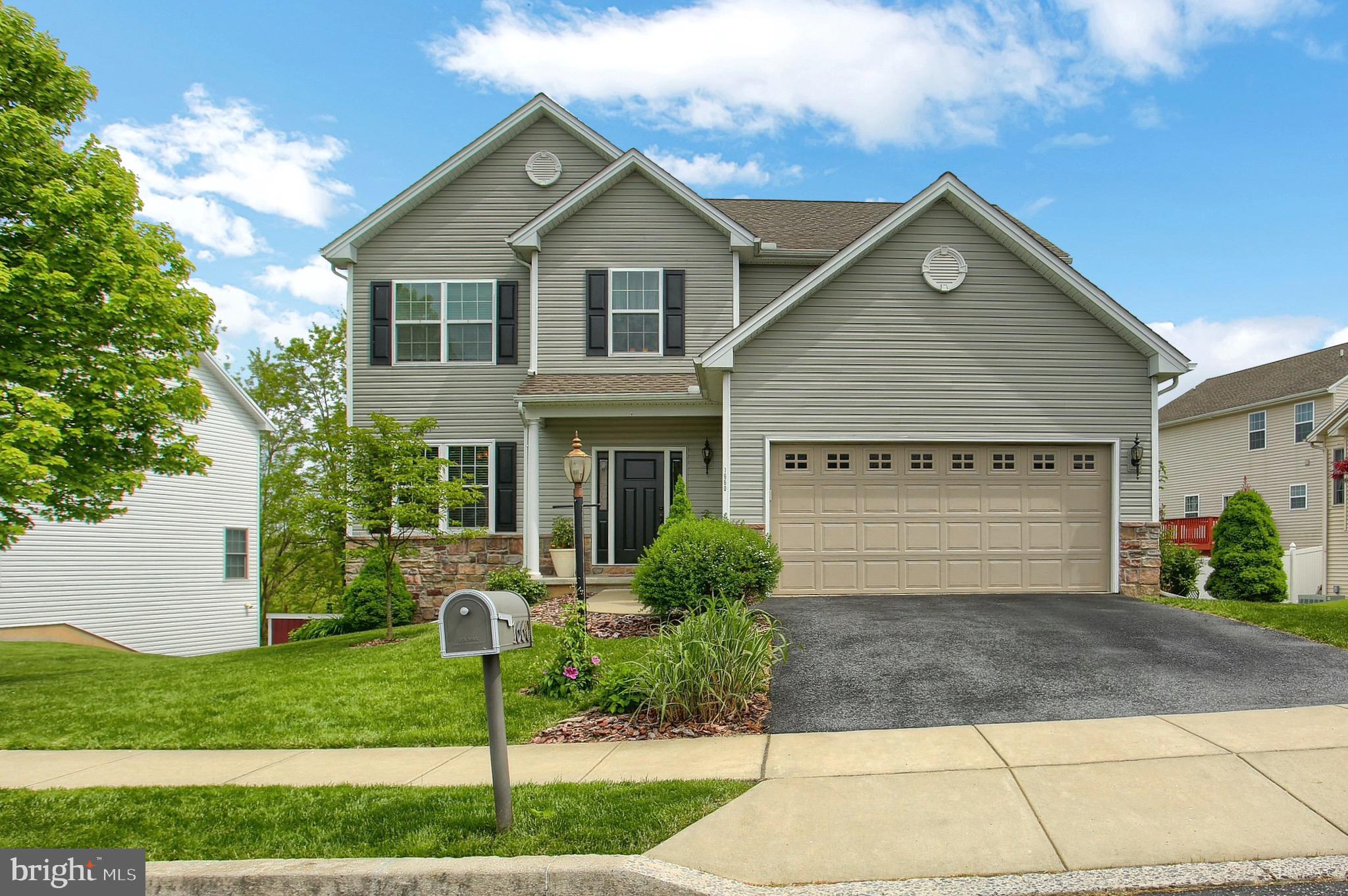 Welcome home to 1660 Lowell Lane!  From the moment you walk into this move-in ready home, you will feel a sense of warmth and comfort.  The owners of this home have made several improvements over the past few years, from fresh paint to new carpet to a brand-new front door, making it into a spectacular space that appeals to one and all!  The kitchen is a chef's dream with ample cooking prep space, a gorgeous island, granite countertops, stainless steel appliances and an oversized pantry.  Family and friends can enjoy meals in the eat-in dining area or the formal dining room.  A fantastic great room extends the entertaining space, complete with gas fireplace.  Walk right out onto the deck and enjoy the tranquility of a secluded backyard - the perfect place to spend time relaxing on those warm summer evenings. Upstairs you will find a spacious master bedroom that does not disappoint, with an en suite featuring double sinks and a desirable walk in closet.  Three additional bedrooms presented in tasteful neutral tones are ready for you to add your own style and finishes.  A second floor laundry space makes life easy - no hauling laundry up and down stairs!  Moving down to the lower level you will find nearly 900 square feet of additional living space with brand new Shaw, pet-protected carpet and an eye-catching wood accent wall.  The entertaining possibilities in the lower level are endless!  A walk-out feature allows you to move right from the lower level onto the beautiful patio which features flagstone and all the joys that Mother Nature has to offer.  This home is an absolute pleasure to show in a wonderful neighborhood whose location cannot be beat.  Do not miss out on 1660 Lowell Lane!