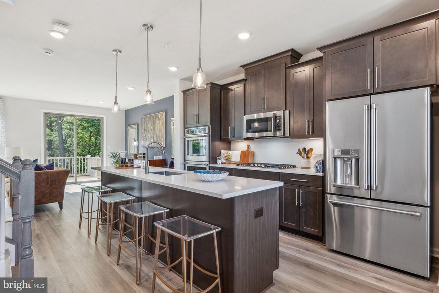 Welcome to the Louisa townhome at Overlook at Westmore! This stunning home offers the perfect combination of modern style and convenient living. With a lower level recreation room and full bath, you'll have plenty of space for entertaining or simply relaxing.

On the main level, you'll find a spacious dining area that flows seamlessly into the gourmet kitchen, complete with top-of-the-line appliances and ample storage space. The family room is the heart of this home, providing a comfortable and inviting atmosphere for spending time with loved ones. And let's not forget about the deck – the perfect spot for enjoying your morning coffee or hosting summer barbecues.

The upper level boasts a gorgeous primary bedroom with an ensuite bathroom, creating your own private oasis to unwind after a long day. Two additional bedrooms and another full bath provide plenty of space for guests or growing families.

*Photos shown are from a similar home.