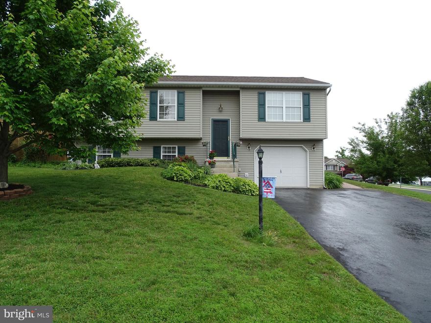 Great home on a terrific corner lot. Features Include: Large Living Room, Spacious Dining Area with Slider to back deck, Eat in Kitchen with Oak cabinets, All Kitchen Appliances included, and custom Built-Ins. Three spacious bedrooms, Hall Bath with double vanity, Large Family room with Half Bath.  Utility Room with Laundry Hook Up. One car garage with opener. Many updates including: New Paver patio and New Roof 2011, New HVAC System in 2014, Insulated garage door and opener in 2008, New family room carpet, Kitchen flooring, and Deck Canopy  in 2018,  This property also features a great fenced in back yard with paver patio, deck with canopy, beautifully landscaped, and ready for a new owner. A pleasure to show.