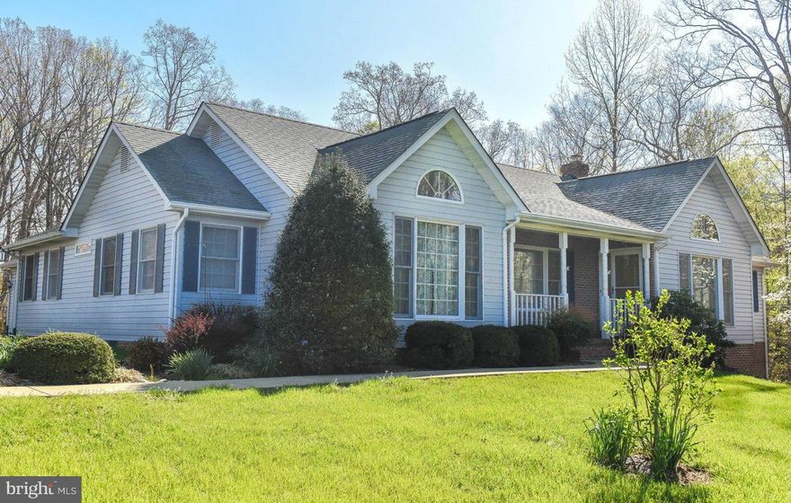 LARGE RAMBLER,well cared for, room to spread out! MBR w\3 closets, jetted tub, & sunroom on one side of home; other side: 3 good-sized BRs, full bath & LR. Great Room w/vaulted ceiling, skylights, gas FP, opens to Eat in Kitchen, and DR. Access to spacious decking. Home is open and filled with sunlight, with great views of private wooded lot. Large walk-in storage area and oversized 2car Garage.