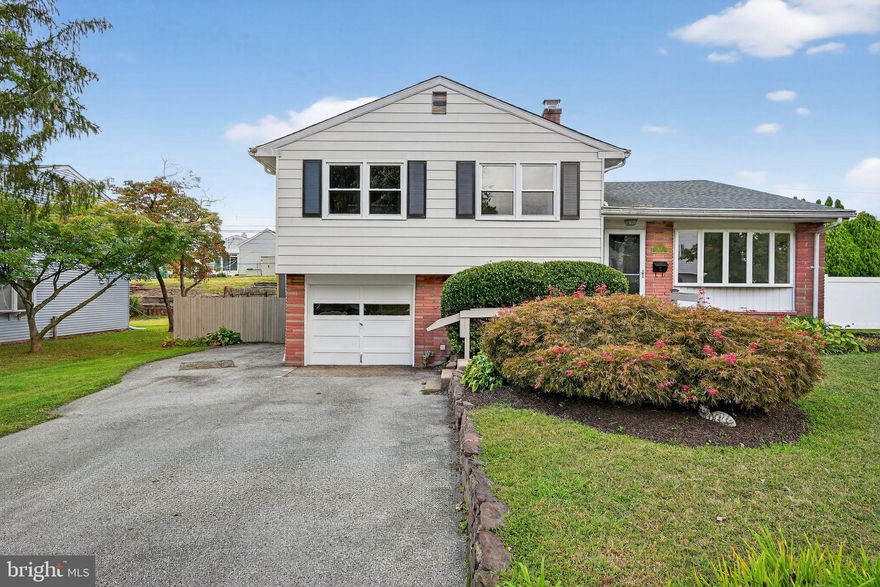 Welcome to 113 E Valley Creek Road, a beautifully renovated 3-bedroom, 1.5-bath split-level home in the heart of Plymouth Meeting. The main level showcases refinished hardwood floors, recessed lighting, and a bright open layout that flows seamlessly into the updated kitchen. Here you’ll find a central island, modern countertops, stainless steel appliances, crisp white cabinetry, and easy access to the sunroom at the back of the home, flooded with natural light and the perfect spot for morning coffee casual gatherings. 

Upstairs, three comfortable bedrooms feature brand-new carpeting and share an updated full bath with modern finishes. The lower level has been thoughtfully finished with durable vinyl plank flooring, a convenient half bath, and plenty of flexible living space that could serve as a family room, home office, or gym. Fresh paint throughout, new windows, and a one-car garage make this home truly move-in ready.

The location is desirable, being just a short walk to East Plymouth Valley Park, a 22-acre community hub with playgrounds, sports courts, fields, and walking paths. With its combination of stylish updates, versatile living spaces, coveted school district, and convenient location near shopping, dining, and major highways, this home offers the perfect blend of comfort and everyday convenience.