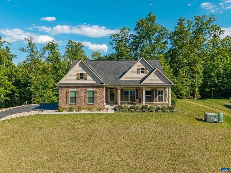 This impeccably maintained, expansive ranch offers main-level living with a partially finished basement and is ideally nestled on a 0.60-acre lot with NO HOA. Built in 2015, this home features a desirable first-floor primary suite and minimal entry with just one step to access the home. The main level showcases an open floor plan with 9? and 10? ceilings, beautiful hardwood floors, a premium trim package including 5? baseboards, wainscoting, and craftsman columns, and abundant natural light. The great room is highlighted by a coffered ceiling and a striking floor-to-ceiling stone fireplace. The kitchen is well-appointed with granite countertops, a large island with a breakfast bar, 42? upgraded cabinetry, under-cabinet lighting, and a five-burner gas range. The spacious primary suite features a tray ceiling, extended square footage, additional windows, and a custom walk-in closet. The ensuite bath includes oversized dual vanities, tile flooring, and a tiled shower. Never run out of hot water with the instant water heater! The finished basement provides additional space with the 3rd bedroom & bathroom, a rec room, office, and tons of storage. This home offers a combination of functional design and indoor-outdoor living opportunity.,Granite Counter,White Cabinets,Fireplace in Living Room