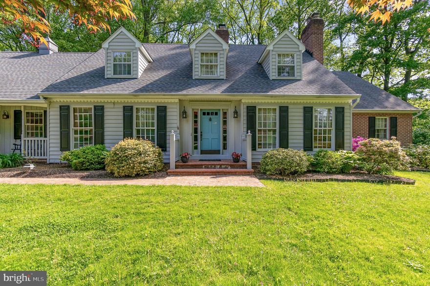 Authentic charm meets modern comfort in this beautifully maintained 4-bedroom, 2.5-bath home located in the sought-after Franklins Chance community of Fallston. Nestled on 1.87 private, wooded acres, this spectacular Williamsburg Cape Cod features wide plank hardwood floors, two full masonry fireplaces, and generously sized rooms throughout. Enjoy a unique layout with a private fourth or fifth bedroom accessed via a second staircase leading to a floored attic with additional storage. Fresh updates include new carpeting on the upper and lower levels (since photos were taken). The walk-out lower level opens to a serene backyard with mature landscaping, garden paths, and space for outdoor entertaining or peaceful nature walks.  Additional highlights include: side-load 2-car garage, deep closets throughout, professionally waterproofed basement (since photos were taken), recently pointed chimney, quiet cul-de-sac setting in desirable neighborhood.   A rare opportunity to own a home that combines historic architectural style with modern updates and abundant natural beauty. Move-in ready and full of character—schedule your tour today!