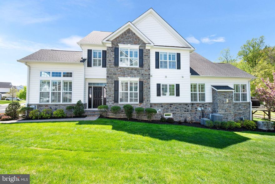 Welcome to this stunning Bucknell end-unit townhome in "The Enclaves" on a premium lot in prestigious Upper Makefield Township. This bright, elegant home features oversized windows that frame serene views of lush woods and a private backyard retreat. The first-floor owner's suite is a true haven, boasting a tray ceiling, an expansive bathroom with a 5' x 5' walk-in shower, and a spacious custom walk-in closet—an exceptional and rare find. The expanded family room impresses with vaulted ceilings, a cozy gas fireplace, and gleaming hardwood floors, creating the perfect ambiance for relaxation and entertaining. A dramatic two-story foyer with a curved staircase and stylish metal spindles sets a grand tone upon entry. Adjacent is the formal dining room, beautifully lit by large windows that enhance the home's open and airy feel. The gourmet kitchen is a chef's dream, featuring granite countertops, upgraded cabinetry, an oversized island, and top-of-the-line appliances. The private office off the foyer offers a bright and functional workspace with custom cabinetry—ideal for working from home. Upstairs, you'll find two generously sized bedrooms connected by a Jack-and-Jill bathroom with double sinks, tile flooring, and ample closet space. A spacious hardwood-floored loft overlooks the foyer and serves as a versatile additional gathering area. The fully finished basement is designed for entertainment and wellness, including a home gym area, powder room, large media/entertainment room, and additional storage. Premium features continue with plantation shutters, high-end window treatments, a full-house generator, and a yard irrigation system, whole house water softener system, separate zoned HVAC system in the basement, twol motor sump pump with battery back up, dehumidifier, and a reverse osmosis water line at kitchen sink and to the coffee maker makes life easier. Step outside to the oversized Trex deck—perfect for al fresco dining or enjoying the peaceful natural surroundings. A convenient staircase provides access to the beautifully landscaped rear yard. Located just minutes from Tyler State Park, the Delaware River towpath, and the charming historic towns of Washington Crossing, New Hope, and Newtown. Enjoy proximity to fine dining, boutique shopping, major highways, the airport, and train stations. This is truly a spectacular place to call home in one of Bucks County’s most desirable communities!