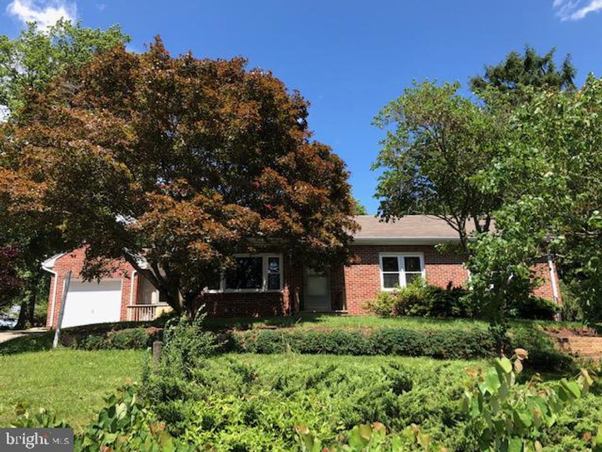 If you are prince charming with some creativity and a few buckets of paint, you can awaken this 3BR brick rancher. All she needs is a little TLC. Set on a beautiful lot with tiered landscaping, the trees act as a canopy of privacy if sitting on the covered back patio or tinkering in the 18x21 detached 2-car garage, with electric, located in the rear of the property. Inside you'll find a living room with a stone wood-burning fireplace; large updated oak kitchen; walk-up attic with floor; partially finished lower level with family room featuring bar and a gas fireplace. A breezeway connects the home and 1-car garage. Some hardwood floors, most replacement windows, new water heater, new gutters and downspouts May 2019, roof approx 13 yrs old, updated furnace and electric. Seller in process of replacing carpet. 1 Year HMS Home Warranty provided to new buyer. Located minutes to West York conveniences, this princess is sure to return your love! AGENTS - Please read Agent Remarks!