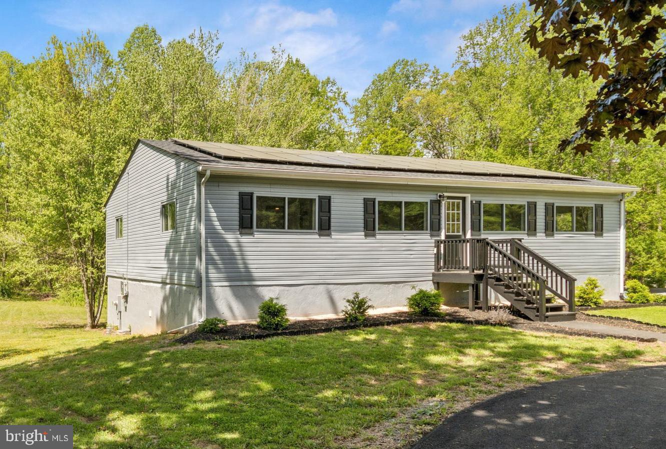 Solar System provides incredibly low bills. The lowest utility cost you will find, which is a huge savings throughout the year.
2 level Lake Anna home under 400k with close access to the lake- Great Value
Renovated 2 level Detached Home: Your Dream Lake House Awaits!
Spacious and open renovated upper level. Acreage! Unfinished walk out basement offers lots of storage and options.
Discover the perfect blend of comfort, style, and tranquility in this stunning home, located on the private side of Lake Anna. 4 spacious bedrooms and renovated baths.
Nestled in the private section of Lake Anna with its own dedicated dock and boat launch for lake access right down the road, this incredible home is on a spacious 1.39-acre lot and is at the end of a quiet dead-end street. This property offers a serene retreat with modern upgrades and luxurious features.
Key Features:
Expansive Space: Rare 2-level home with 2940 sq. ft., including a finished 1470 sq. ft. upper level featuring 4 bedrooms and 2 full baths. The lower unfinished basement walks to the back yard.
Unique characteristics: Solar system for very low utilities, wooded views on a large lot, 2 level home for more space, paved circular driveway, renovated kitchen w/ stainless steel appliances and granite counters, renovated bathrooms.
Prime Lake Living: Private Lake access and Lake privileges. HOA is only for private lake access and privileges (not open to the public). Neighborhood boat launch, pier, and boat slips are available. Enjoy golf-cart-friendly streets and the lake lifestyle you’ve been dreaming of! Relax in the lake lifestyle- close to wineries!
Modern Comforts: Renovated kitchen with granite countertops, newer cabinets, stainless steel appliances, stylish backsplash, and a large kitchen bar with extra storage. Luxury vinyl flooring and freshly painted interiors enhance the home’s light-filled, open-concept design.
Energy Efficiency: Save big with a solar panel system, a newer heat pump, and a new roof—enjoy electric bills as low as $25/month!
Updated Bathrooms: New tubs, showers, plumbing, and modern finishes throughout.
Outdoor Bliss: A large backyard backing to a wooded area offers privacy and endless possibilities. An exterior shed provides extra storage for all your outdoor gear.
Convenience: High-speed internet, a custom California like closet in the main bedroom, recessed LED lighting on main floor, a security system, a new well pump, and a water filter system ensure every modern amenity is at your fingertips. There is ample extra parking with a paved circular driveway.
Low Maintenance: Benefit from low HOA fees and minimal upkeep, so you can spend more time enjoying life by the lake.
This home combines the peace of lakeside living with all the upgrades and conveniences you need. Schedule your showing today and start living the lake life you’ve always wanted!