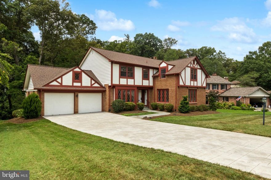 MAJOR PRICE REDUCTION!  Almost $95,000 less than original asking price. Welcome to this beautiful Tudor-style home tucked away on a quiet cul-de-sac, offering over 3,700 finished square feet of comfortable living space. Step inside to find freshly refinished red oak hardwood floors on the main level, new carpet upstairs and on the stairwells, and brand-new LVP flooring in the lower level. The kitchen has been fully remodeled with new appliances—including a stove, microwave, and refrigerator—plus new faucets, light fixtures, and matching door hardware throughout.

Enjoy five spacious bedrooms and three and a half updated baths, each with new vanities and modern finishes. The gas fireplace creates a cozy focal point in the living area, while the lower level offers extra space for relaxing or entertaining. The HVAC system features a humidity control system and air purifier for year-round comfort.

Outside, a large backyard deck surrounded by privacy greenery is perfect for gatherings or quiet evenings. The deck has a built in gas line so you never have to get propane refils for your grill. The entire home, including the two-car garage, has been freshly painted. Located near Fairfax City, the Vienna Metro, I-66, and I-495, with optional membership to the nearby Mantua Swim and Tennis Club, this home blends convenience, style, and comfort. Come see why this home is so inviting!