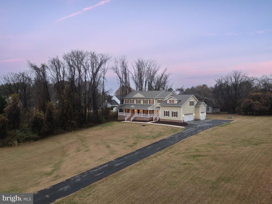 Welcome to 14239 Seneca Road in Darnestown, a 1.09-acre sanctuary that brings together refined living, quiet natural charm, and effortless comfort. It's the kind of property that immediately feels welcoming, spacious, tranquil, and beautifully in tune with the landscape around it. Part of the Spring Meadows subdivision and free from HOA restrictions, this one-of-a-kind custom home offers a rare sense of privacy and the freedom to shape the lifestyle you want. A sweeping forty-six-foot covered brick front porch creates a warm, gracious welcome and hints at the thoughtful design carried throughout the home, built with care by the original owners. Inside, natural light fills each room, lifted by 9-foot ceilings and a floor plan designed for both easy gathering and comfortable retreat. The updated gourmet kitchen is a true centerpiece, featuring custom cabinetry, new quartz countertops, premium appliances, and an inviting breakfast area that opens through French doors to peaceful backyard views. The breakfast area and the formal dining room make the main level ideal for everything from casual mornings to elegant dinner parties. Nearby, the light-filled great room, anchored by a cozy natural gas fireplace, opens to a secluded 17' x 17' screened-in porch, the perfect spot to enjoy quiet mornings and relaxing evenings as you take in your peaceful surroundings. The private backyard attracts a variety of wildlife year-round giving you a front row seat to nature. The main level also features a spacious first-floor primary suite with generous walk-in closets and a spa-like bath. Completing this level are a mudroom, pantry, powder room, laundry room, the convenience of both front and rear staircases, and an over-sized 3-car garage, thoughtfully placed to make daily living feel seamless. Upstairs, four large bedrooms, each with its own private ensuite bath, offer comfort and privacy for family and guests. The upper-level family room is an unexpected showpiece: a vast, sunlit gathering space with skylights, a natural gas fireplace, and a full wet bar with sink, dishwasher, and beverage cooler. Together with a second laundry room steps away, this level functions almost like a self-contained wing, perfect for family game nights, movie marathons, or a private oasis for overnight guests. The expansive lower level adds more than 2,600 square feet of possibility, offering an open layout with high ceilings, a finished full bath, and a walk-up exterior entrance. Whether you envision a home gym, theater, guest suite, or creative studio, the space is ready to evolve with your needs while still providing abundant storage. Throughout the home, every detail reflects quality craftsmanship and long-term care—from the hardwood floors and ceramic-tiled baths to the HardiPlank siding, fire sprinkler system, central vacuum, and whole-house water filtration. A Generac natural gas generator, a newly installed tankless hot water heater, updated HVAC systems, and recently replaced appliances further enhance comfort and efficiency. Ideally located between Germantown, Gaithersburg, and Potomac, the property offers quick

access to shopping, dining, parks, and major commuter routes, including River Road, I-270, Route 28, and Great Seneca Highway. The surrounding area is known for strong long-term property appreciation, making this home not only a peaceful retreat but also a smart investment. Beautifully maintained, thoughtfully updated, and perfectly situated, this is a rare opportunity to enjoy privacy, space, and luxury in one exceptional setting. This is more than a home, it's a lifestyle.