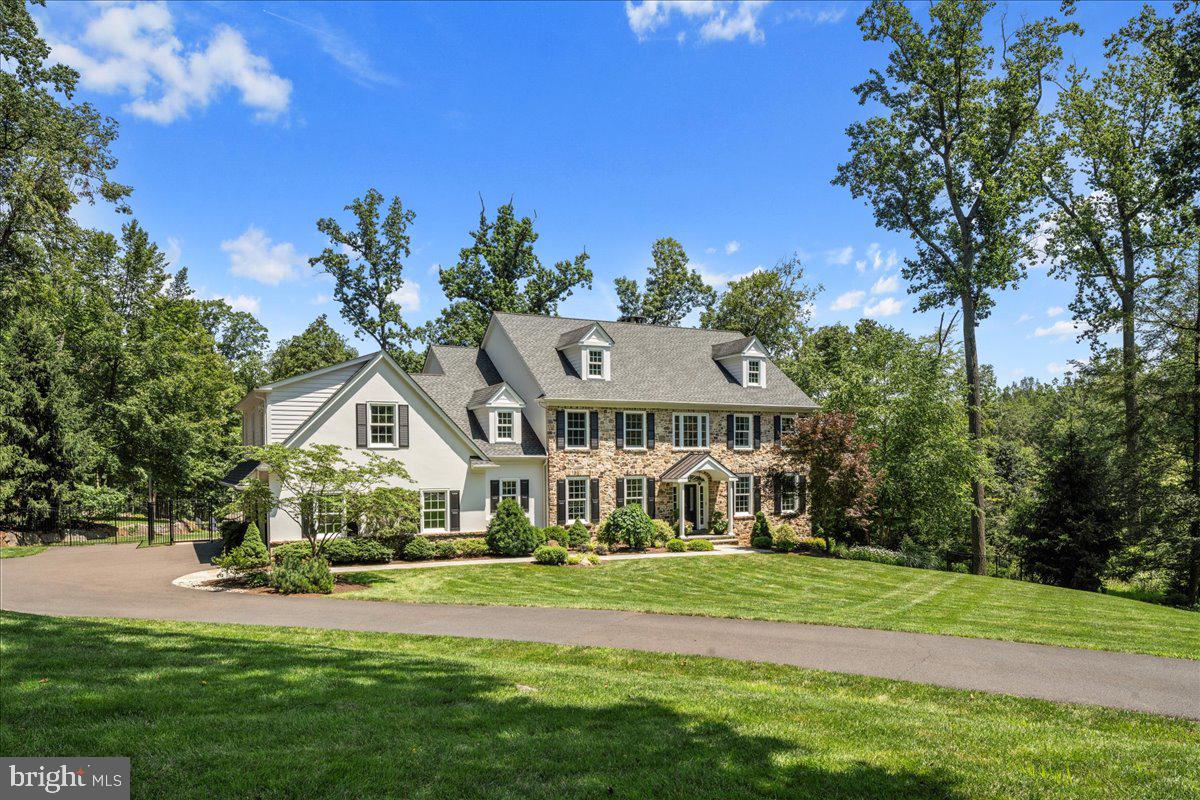 Nestled in the prestigious rolling hills of New Hope, a private, winding lane unveils an exclusive collection of Zaveta custom homes, celebrated throughout the region for their unparalleled craftsmanship, elegant design, and meticulous attention to detail. This extraordinary 3.3-acre property at Rockwood Farm epitomizes a seamless blend of timeless architecture and serene natural beauty. Perfectly situated, it offers private nature views and captivating seasonal views of the Delaware River flowing well below.
Constructed in 2011, the home's classic design boasts hand-chiseled fieldstone, hurricane-rated windows, architectural shingles, and a low-maintenance gutter guard system. Also featured is a Kohler whole-house generator (2022), ensuring comfort and peace of mind.
The entire residence underwent a meticulous, top-to-bottom update in 2023. Key enhancements include fresh interior and exterior paint, plush new carpeting, and all interior lighting fixtures replaced with designer lighting from Rejuvenation and Arhaus. Every one of the six bathrooms has been transformed with new quartz countertops, Kohler fixtures (toilets, faucets, sinks), lighting, mirrors, and updated cabinet hardware. The heart of the home, the kitchen, received a stylish refresh with professionally painted cabinets, Rejuvenation hardware, a custom hand-painted marble tile backsplash above the range, a Wolf built-in microwave, a Rachielle custom workstation sink, instant hot water, a reverse osmosis system, and Kohler faucets. Further notable upgrades include a new water softener, hot water heater, a Sonos sound system with indoor and outdoor speakers, and a comprehensive garage wall system.
At its core, a beautiful white chef’s kitchen is outfitted with premium appliances, including a Thermador gas range and a Sub-Zero refrigerator. The adjacent area provides tranquil views and direct access to the rear patio an ideal spot for quiet mornings or relaxing evenings.
Upstairs, the luxurious primary suite is a true sanctuary, featuring its own gas fireplace, an oversized custom walk-in closet, and a spa-like bathroom. The second floor also hosts three additional en-suite bedrooms, two of which are generously sized with unique sitting areas and walk-in closets.
The walk-out lower level offers a versatile retreat, perfectly designed for entertaining or multi-generational living. It includes a full in-law suite with a bedroom and bath, a recreation room, a kitchenette, a fitness room, and ample storage. Step directly outside to a private bluestone patio and a brand-new Caldera saltwater hot tub (2024). The professionally landscaped exterior features terraced gardens, stone walkways, a fenced backyard (2024), an irrigation system, landscaped lighting, and hundreds of new plantings (2024).
All of this is set within the award-winning New Hope-Solebury School District, with convenient access just 75 minutes to NYC and 40 minutes to Philadelphia.
This is more than a home, it’s a lifestyle of elegance, comfort, and peace in one of Bucks County’s most exclusive enclaves.