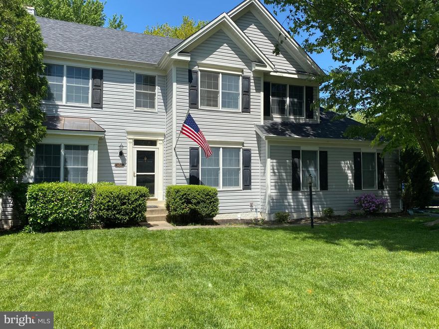 Wonderful 3 Level Colonial on corner lot  with side load 2 car garage the in Sycamore Ridge community!  Fresh Paint, hardwood Flooring in kitchen and family room.  4 large upper level bedrooms include a master bedroom with updated bathroom and soaker tub.  Updated hall bath with new paint and flooring.  Upstairs laundry!!  Family Room has a gas log fireplace and walkout to a large deck with privacy landscaping.  Kitchen boasts new appliances including a gas stove, microwave and refrigerator.  Finished basement with full bathroom and plenty of storage!!  So many other updates throughout! Recently updated hot water heater, roof, gutters, siding, HVAC system,  garage door, humidifier and sliding glass door.