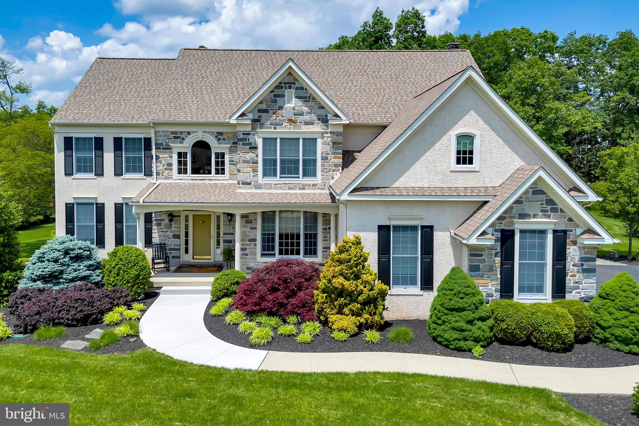 Welcome to this stunning 4-bedroom, 2.5-bath home built by WB Homes in Lower Salford Township, offering over-the-top upgrades and luxury details throughout—perfectly set on a beautifully landscaped 1.9-acre lot.
Step into the grand foyer with porcelain tile, an elegant ceiling medallion, and an impressive chandelier. The formal living and dining rooms boast rich hardwood flooring, wainscoting, coved ceilings, and a dazzling Swarovski chandelier. The private office is ideal for remote work with hardwood floors and a ceiling fan.
The gourmet kitchen is a chef’s dream: hardwood floors, granite countertops, Sub-Zero refrigerator and wine fridge, GE Monogram 6-burner gas cooktop with stainless hood, GE Profile double ovens, microwave, wine refrigerator, under-cabinet TV, and custom lighting. The family room impresses with an 18-ft ceiling, a wall of windows, custom draperies, a gas stone fireplace, cherry wood built-ins, surround sound, and gleaming hardwoods.
Upstairs, all four bedrooms feature plush carpeting and ceiling fans. The luxurious primary suite offers a coved ceiling, three closets, and a spa-style bath with a jetted tub, tile shower, double vanity, and private water closet. A second full bath includes a walk-in tiled shower, double vanity, large closet, and custom finishes.
Additional features include: Two staircases (foyer and family room), Hunter Douglas Duette shades throughout. 3-car garage (two-car plus separate one-car section) with Keyless garage entry 2-zone gas heating & electric A/C, Upgraded Kohler fixtures & lighting throughout, Full basement with tankless water heater, 2 high-efficiency gas furnaces, water softener, whole-house air filter & humidifier.
The Outdoor living is a dream: Brazilian mahogany deck, flagstone patio, wood-burning stone fireplace, water feature, professional lighting, lawn irrigation system, two sheds, and fenced-in yard—perfect for pets!, Ring doorbell, and full security system included.
This exceptional home combines timeless elegance with modern comfort in a premier neighborhood. Schedule your private showing today!
