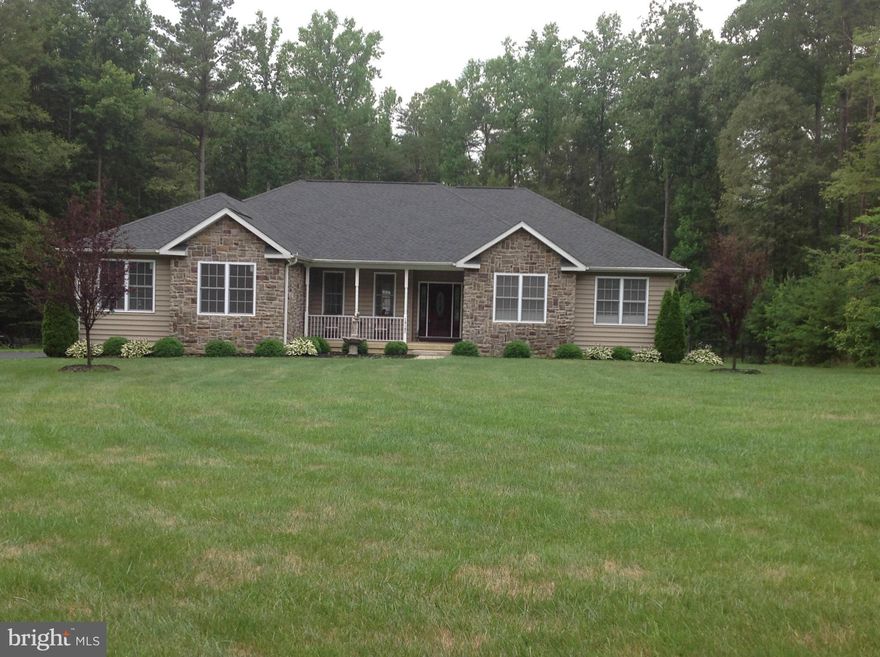 It's a 10.5, stunning custom rambler with custom finishes thru out, cherry flooring on main level (exc. bdrms), marble bath, custom trim, built in;'s in guest room, large mud/laundry w/ built in's, full fin. bsmt, open to include bdrm with full bath + 1/2 bath. Detached  40 x 50 det. garage PLUS 3 car attached garage, Fenced yard in rear, quiet location, no covenants, easy access to Rt 5.