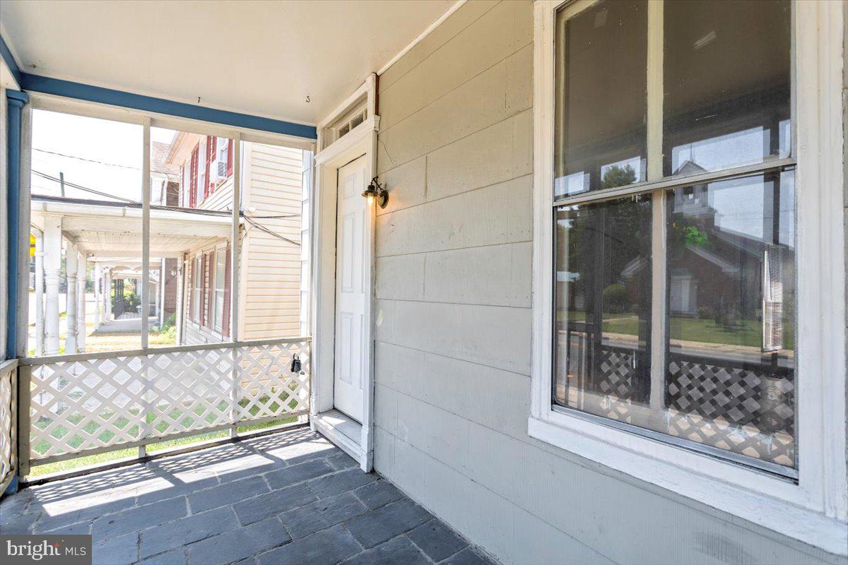 Welcome to 515 Main Street in the heart of Church Hill — a charming 1909 end-unit townhouse that blends classic character with great potential. This 3-bedroom, 1-bathroom home offers 1,284 square feet of living space filled with potential and character. Whether you're an investor or a buyer ready to put your personal touch on a historic property, this is a fantastic opportunity.
Inside, you'll find original wood floors in some rooms, brand-new carpet in the primary bedroom, fresh flooring in the kitchen and large laundry room, and a flexible bonus room off the primary that's perfect for a home office, nursery, or walk-in closet. The bathroom and bedrooms are generously sized, and there's a partial basement with outside entry for added storage.
The home sits on a 0.14-acre lot with a partly fenced yard and plenty of space to create your ideal outdoor setup. Located just a short walk from local shops, the post office, and schools, it's perfectly situated for convenience while still offering small-town charm.