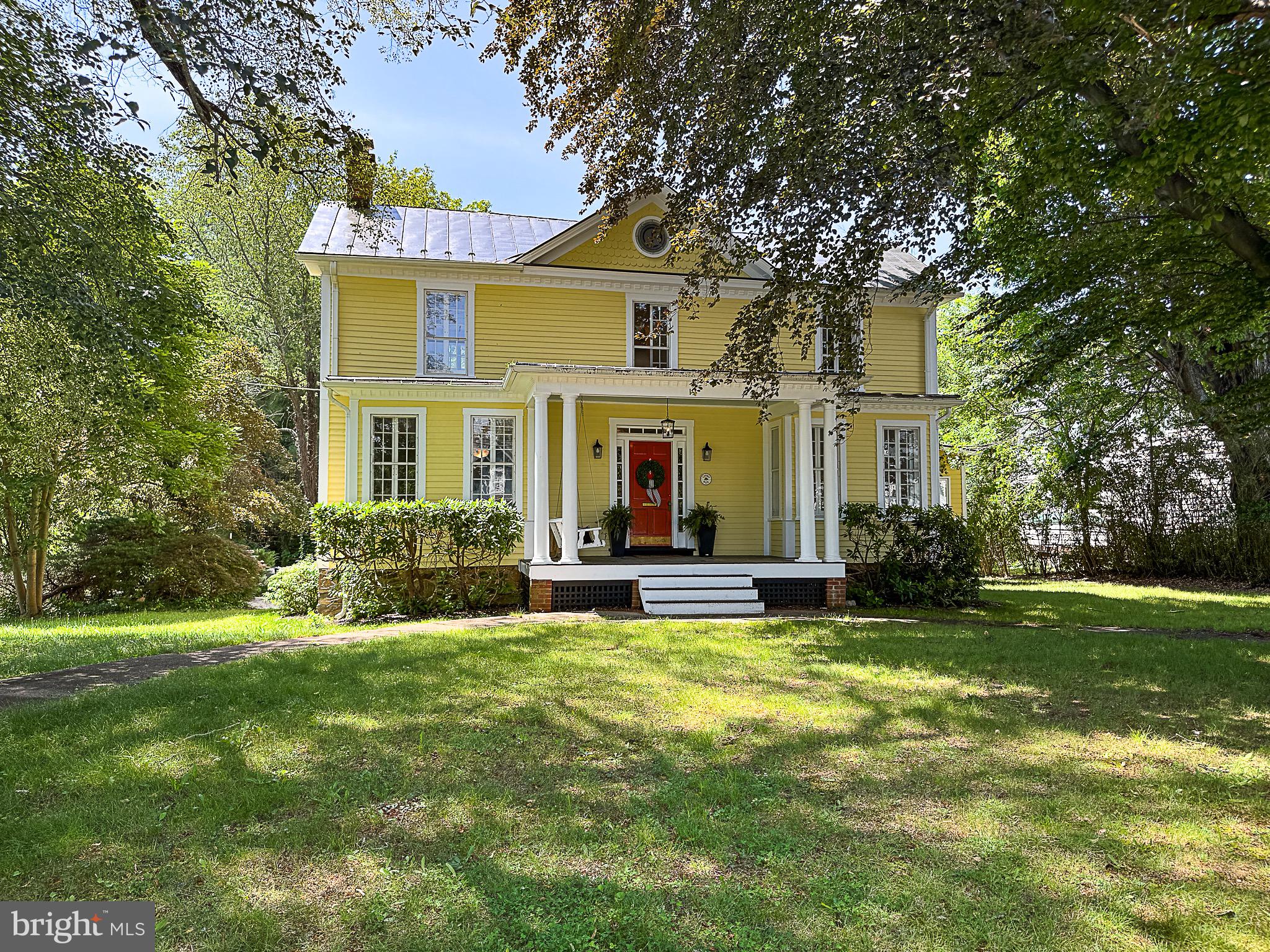 Corner Hall, a significant Victorian contribution to Historic Round Hill. Built by the Ballenger Family, Corner Hall was the westernmost restaurant from the 1930's to 1960's. Iconic home with original front wall with great curb appeal. A perfect blend of historic elegance and modern comforts, all nestled on a generous 0.66-acre lot. Zoned R-2 in the Town of Round Hill allows Accessory Uses, Bed and Breakfast...
Step inside this inviting 3,552 square-foot residence and discover four spacious bedrooms and three and a half baths. The heart-pine floors and mahogany woodwork set a warm and welcoming tone throughout.
The home features a thoughtfully designed layout catering to both relaxation and entertainment. The eat-in kitchen is perfect for casual meals, while the separate dining area allows for more formal gatherings. Plus, there's a separate apartment with its own kitchen and bath, ideal for guests or as a rental space.
Recent updates include fresh exterior and interior paint, brand new garage doors, and renovated porches and deck.
Outside, enjoy extensive hardscaping and beautifully maintained grounds that provide a peaceful retreat. Whether you're sipping coffee on the porch or hosting a summer barbecue, this home offers endless possibilities.
Don't miss your chance to own a piece of history.