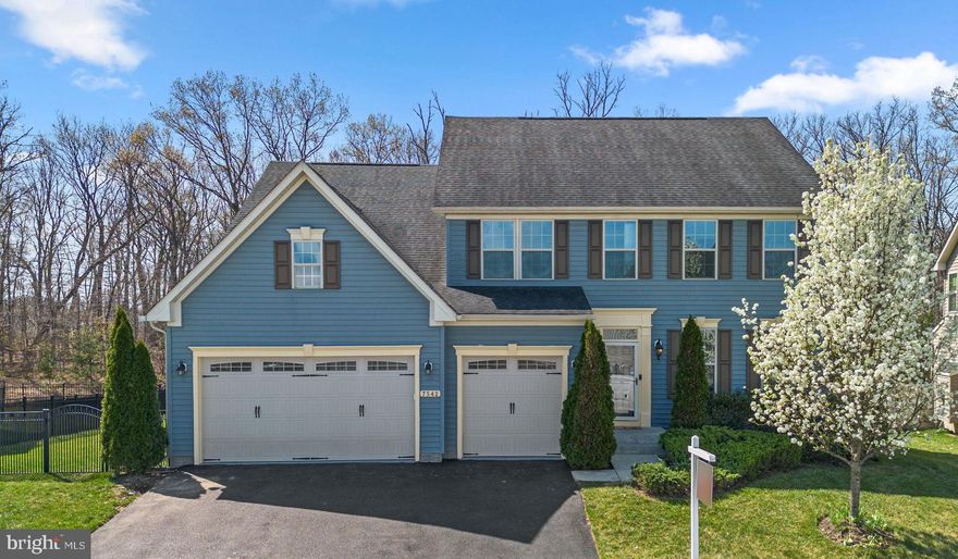 Welcome to 7542 Arundel Woods Drive—an exceptional Colonial home offering space, versatility, and thoughtful upgrades, all set in a private, tree-lined setting in the heart of Jessup.  Step inside to a welcoming foyer with a private office or flex room positioned to the right, ideal for working from home, creating a quiet retreat, or to be used as a formal living or dining room. Continuing through the main level, you'll find the 22x18 great room, which is wonderful for everyday living and entertaining, and features a cozy and convenient gas fireplace.  The expansive kitchen is truly the heart of the home, showcasing a large center island, abundant cabinetry, stainless appliances and a spacious dining area. From the dining area, step outside to an impressive composite deck—approximately 400 square feet—overlooking a fully fenced backyard and peaceful wooded views, creating a true outdoor retreat. Additional exterior features include a lawn sprinkler system and a setting that offers both privacy and space for outdoor activities.  Back inside, the main level also includes a full bedroom with an attached full bath, providing flexibility for guests or multi-generational living, or use as a second office space, playroom or craft area. This area of the home is also where you will find the mudroom, which connects directly to the garage.    Upstairs, the spacious (18x16) primary suite offers a private retreat with an expansive custom-built walk-in closet and an attached primary bath. Here you'll find 2 separate vanities, a large walk-in shower, and separate W/C.  Two additional bedrooms are separated by a Jack and Jill bath, while the 4th bedroom offers its own private bath. You will also find the laundry room located on this level.    The fully finished lower level tremendously expands the home’s living space with a large workout or potential 6th bedroom, a full bath, plus an open recreation/playroom/family room with a bar and entertaining space. There are double wide walk-out stairs to the fenced rear yard.    **    The home features fresh paint throughout and new engineered hardwood flooring across the primary living areas, enhancing both style and durability. Additional features include solar panels for energy efficiency (these are not leased but rather on a Power Purchase Agreement currently priced at $147.50/month) and a tankless water heater, adding long-term value and modern convenience.    **    Ideally located with easy access to Route 100, I-95, Route 1, and Route 29, this home offers a seamless commute to Baltimore, Washington, and surrounding areas. Enjoy close proximity to Arundel Mills Mall, plus additional shopping, dining and entertainment options nearby.    **    7542 Arundel Woods Drive offers the perfect balance of space, updates, and lifestyle—an exceptional place to call home!