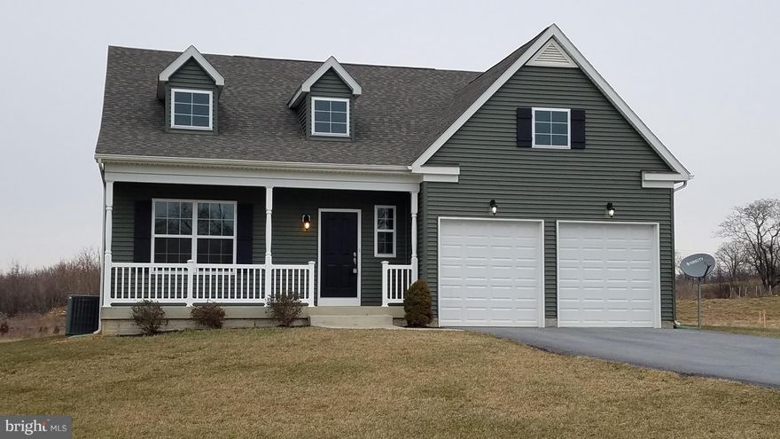 Beautiful rancher in The Lakes at Martinsburg sitting on a premium lot overlooking the lake.  9' ceilings on the main level. Engineered hardwood flooring in living areas, ceramic tile in kitchen and bathrooms. Kitchen has center island, granite tops and SS appliances. Covered front porch and 10' x 16' composite deck on back. A full unfinished basement for future expansion. This is a must see.