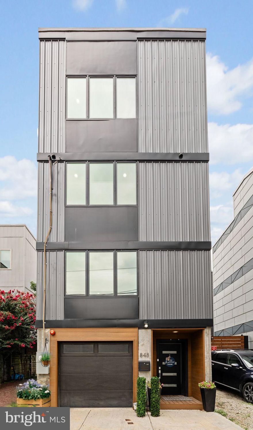 Welcome to 848 N Leithgow Street, a truly rare find in Northern Liberties. This free-standing, single-family home offers 4 bedrooms, 3.5 bathrooms, and a private attached garage, tucked along a quiet, community-oriented block that feels like your own hidden retreat. Built in 2021 with five years remaining on the full 10-year tax abatement, this residence blends modern comfort, generous space, and privacy in one of Philadelphia’s most vibrant neighborhoods.

A modern, elegant facade sets the tone upon arrival. Inside, a contemporary foyer welcomes you with access to a private office, a convenient half bath, and a rear patio. One level up, the heart of the home unfolds with a beautifully designed kitchen featuring striking cabinetry, a large island, and ample space for both living and dining. Blond hardwood floors run throughout, while oversized windows flood the home with natural light, creating a bright and seamless flow.

The next floor includes two nicely sized bedrooms, a full hall bathroom with beautiful finishes, and a conveniently located laundry area. Ascend to the level above and discover a spacious and inviting primary suite, complete with three outfitted closets and ensuite bath. The luxurious bath features a gorgeous free standing soaking tub, attractive tiling, and a modern double vanity with fog free mirrors. The space is equal parts functional, private, and serene.

Perhaps the best part of this modern gem is a dynamic roof top terrace, with generous proportions and even better Center City skyline and Ben Franklin Bridge views. What better way to wake up or unwind than to drink in the ambiance of this outdoor space! Of course, the private garage offers the ultimate in city convenience: storage, secure access, and on demand parking! The finished lower level boasts a large bedroom and en suite bath, which makes it an ideal space for a guest suite, family room, gym, playroom and more.

Located just a short walk to 2nd Street’s restaurants and cafes, and close to Fishtown, Old City, and Center City, with quick access to the Ben Franklin Bridge, 848 N Leithgow Street offers the privacy of a detached home with the energy and access of city living. Plus a tight-knit community, friendly neighbors, and regular block parties that make this more than just a house—it’s home.