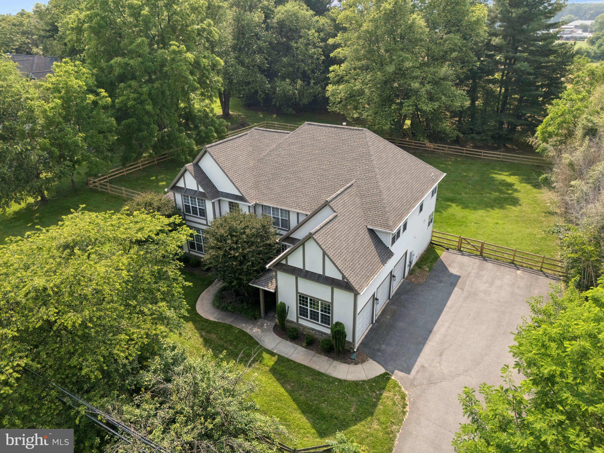 Completely redone in 2024, this home has nothing to do but move in to luxury! Stately Tudor colonial boasting over 6300 finished sq ft. on level lot with pastural views with a brand new roof. Main level boasts hardwoods throughout, a 2 story family room w/ gas fireplace, brand new chef's kitchen with a double wine fridge island, laundry/coffee station, office, 2 slate patios, and a gorgeous sunroom, legal bedroom used as an office and a half bath, and a 3 car side load garage. Upper level features a primary suite from your dream with the same hardwood floors, double walk-in closets w/ custom storage, a redone bathroom w/ separate tub, double vanities, and redone tile floors and shower. Also upstairs is an 2nd bedroom and hall bath, as well as a 3rd and 4th bedroom sharing a jack and jill bath. The fully finished basement includes a den, huge open tv room w/ wet bar, a full bath, and 2 oversized storage areas. 2 zoned hvac and ac redone last year. New fence installed in last 12 months in rear yard, every bathroom, light fixture, fixtures, and the hot water heater all redone/replaced at the same time. All of this minutes to River Rd, 28, and all major commuting routes around the county in a gorgeous private setting. Home is in perfect condition just awaiting a new owner.