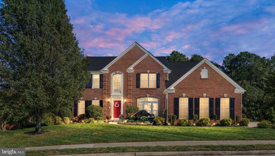 Welcome home! If you’re looking for luxury, this spacious four-bedroom, four-and-a-half-bath residence in The Estates at Lee’s Park Estates offers almost 4,700 square feet of elegance and comfort that will not disappoint. 
A chef’s dream, the gourmet kitchen features double ovens, an oversized island with breakfast seating, upgraded cabinetry, and stunning granite countertops, sure to please any culinary enthusiast. The open floor plan includes expansive living areas, a formal dining room, and a beautiful sunroom that opens onto a deck—ideal for seamless indoor-outdoor entertaining. The family room, enhanced with a cozy gas fireplace, provides a perfect spot to relax and unwind. 
Throughout the main level, transom windows flood the home with natural sunlight, adding a warm and welcoming ambiance to every room. 
The main level also boasts a spacious formal living room, perfect for hosting gatherings, and a private office suited for remote work. Upstairs, discover four well-appointed bedrooms, including a guest room with an en-suite bathroom. The luxurious primary suite serves as a serene retreat with a generous sitting area, custom walk-in closets, and ample space that can be tailored to your needs—whether for a reading nook, nursery, or home gym. Secondary bedrooms share a spacious hall bath, ensuring comfort and privacy for all.
 The fully finished lower level offers even more living space, featuring a theater room, an additional full bath, and a versatile flex space ideal for a gym or secondary office. A side-loading three-car garage provides abundant storage, and the upgraded lot backs up to a beautiful wooded area, offering peace and privacy surrounded by nature. Don’t miss the chance to make this exquisite home yours!