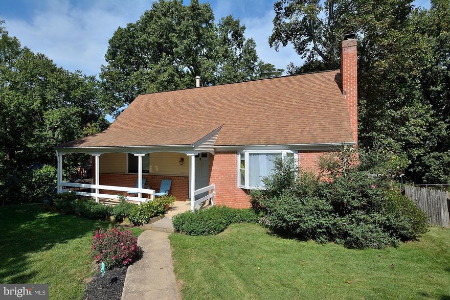 Large, beautiful Cape Cod with hardwood floors, updated kitchen and baths, sun room addition, lower level kitchenette, and right across from Metro bus stop. Lower level has au pair suite potential.  Solid brick construction with some vinyl siding. Beautiful lot with mature trees, flowers, and plants. Owner has invested a lot in this lovely home. 2-10 Home Buyers Warranty. Patio + fenced rear yard.