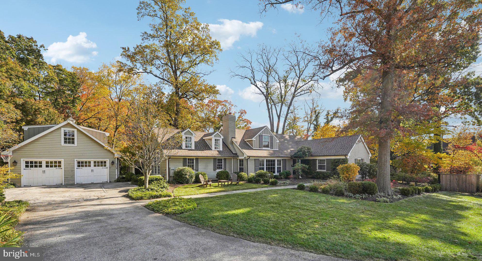 Fantastic Cape Cod style home that has been tastefully reconfigured and expanded for today’s modern living. Ideally located, just a quick walk to downtown Wayne, this spectacular home features a first-floor primary suite, an additional guest suite over the garage, and an incredible kitchen/family room addition that makes social gatherings a treat! Many custom features include hardwood floors throughout, built-in cabinetry, deep windows, crown moldings, built-in speakers, and multiple French doors accessing the extensive outdoor spaces. The charming front entrance leads to the traditional sun-filled Living and Dining Rooms which provide a perfect setting for more formal entertaining. The heart of the home is a gorgeous Eat-in Kitchen/Family Room featuring high ceilings with beams, custom lighting, built-in speakers in first floor and patio, custom Wood Mode and Brookhaven cabinetry, and French doors to a lovely blue stone patio. The cook's kitchen also includes a large Sub-Zero wood refrigerator with filtration, two Franke sinks and faucets with Instant Hot, Viking Stove, Warming Drawer and Granite Countertops. A spacious island and large open floor plan provide much in demand space for informal entertaining or casual family gatherings. The newly renovated den with built-in bed and French doors to a brick patio is a more private space for use as a second at-home office or for just relaxing after a busy day. The private first floor Primary Suite includes a gorgeous limestone with porcelain tile bath with oversized soaking tub and stone floored glass shower. There is a large walk-in closet with lots of custom fittings and a window providing natural light. Also, on the first floor is a spacious flex room with attached laundry room. The fully renovated second floor includes one bedroom with en-suite bath and two additional bedrooms and a full bath. All bedrooms have spacious walk-in closets and there are several attic storage spaces. The finished basement provides lots of storage, a work room and a separate TV/game room with a sound deadening ceiling to allow for peace and quiet to the floor above. Outside, the extensive hardscaping with bluestone patios are complemented by lovely gardens with specimen plantings extending across the length of the rear of the house and custom trellis work. In addition to the sophisticated hardscape there is a large fenced grassy play area and an electric fence for pets. An over-sized semi-detached garage with carriage doors was added as part of the extensive renovations. Above the garage is finished with a bedroom, sitting area and a full bath, suitable for nanny quarters or guest suite. With a premier location in the desirable town of Wayne, a 10 minute walk to shops, restaurants and train, award winning public schools, and close proximity to major highways, this lovely home will offer unparalleled convenience and great privacy to its new owners.