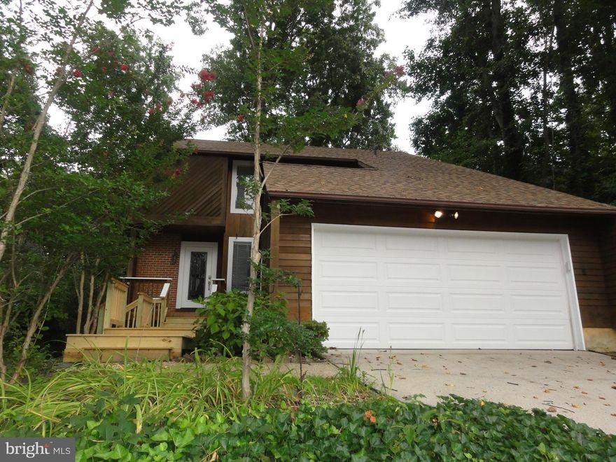 **LOVINGLY CARED FOR CONTEMPORARY IN WALKING DISTANCE TO COMMUNITY MARINA**INTERIOR FEATURES 3 FINISHED LEVELS W/GORGEOUS BAMBOO & MAHOGANY FLOORING, FIRE PLACE, CUSTOM BUILT-INS, DECORATIVE CERAMIC TILE, CROWN MOLDING, SURROUND SOUND, ANDERSEN WINDOWS & LL WOOD STOVE*EXTERIOR OFFERS REAR PATIO, OVER-SIZED FRONT PORCH & LOW MAINTENANCE YARD W/NATURAL LANDSCAPING*NEW ROOF, HVAC & WATER HEATER*