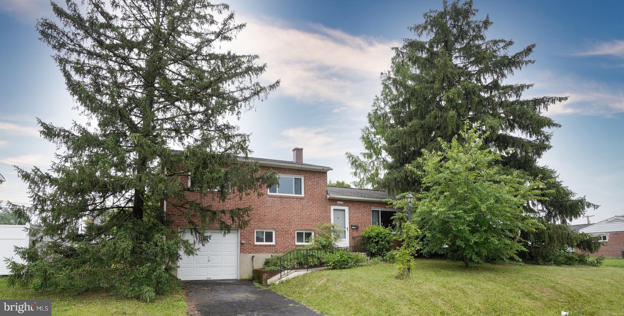 Welcome home to this nice split level in Catonsville's Westview Park neighborhood. This brick (low maintenance) home is located on a corner lot with many nice trees for great privacy. The roof was installed in 2018 and many of the windows have also been replaced. You'll love the hardwood floors, and the new low-maintenance floor on the lower level family/game room or office. There is also a half bathroom on this level. The basement has a door with access to the backyard. Plenty of room to spread out on the main level's kitchen, living room or dining room. There is also a covered back porch with room for furniture, grill, etc. The upper level consists of 3 bedrooms with hardwood flooring and an updated full bathroom with shower and tub. The garage with inside access is very convenient. The shelving with supplies in the garage and utility room, and the workbench in the garage convey with the sale. The wood stove in the living room has not been used recently and will be sold As-Is. This home has been professionally deep cleaned just recently. This home is located close to many restaurants, stores, parks, and commuter routes. Come take a look!