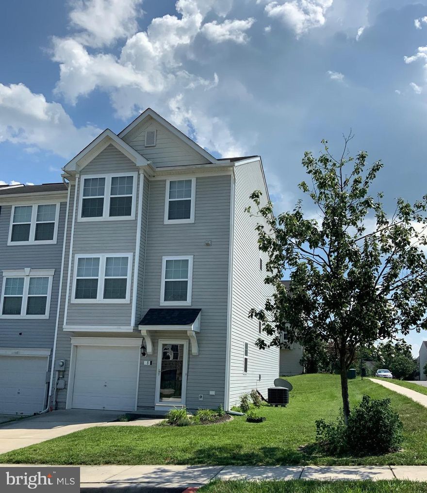 Spacious three-level fully finished townhome in excellent condition. Lots of natural lighting, freshly painted throughout, professionally cleaned carpet and hardwood flooring are highlights of this large 3-bedroom end-unit townhome. The 2nd level is an open floor plan that includes an upgraded kitchen with island, custom lighting, all appliances (Refrigerator, Stove, Microwave, Dishwasher and Garbage Disposal), and dining alcove create a separation of the large living room from the equally large family activity room. There is also a half bath off the activity room. The upper level includes the primary bedroom, ensuite with separate shower and garden/soaker tub and linen closet in addition to a walk-in closet. The upper level also includes two additional bedrooms, full bathroom in the hallway, and another linen closet. The lower level contains a foyer with a glass storm door, entrance to garage, plus a keyed door to walkout to rear of unit, a half- bath, two open plan rooms perfect for movie watching, and/or exercise area, alongside an enclosed laundry area with like-new washer and dryer. Parking off-street in one car garage and a concrete driveway.  There are additional unassigned parking spaces very near the house on the side street and/or center section of the street fronting this unit. This lovely 2700 finished square feet of living space is located in the great community of Riverside Villages in Falling Waters, in the northern part of the Panhandle of Berkeley County, West Virginia. Conveniently located close to Hagerstown, MD and Martinsburg, WV (approx 12 miles to either city center. Easy access to I-81,I-70 & Rt 11. Community sidewalks throughout.  Within walking distance to grocery store, gas station, Dunkin Donuts, Dollar General and a few different small restaurants & businesses. The tenant will be responsible for all utilities (Electricity, Water/Sewer, Internet, Cable, Trash pickup, yard mowing). Rentspree application for credit and background required for each person over the age of 18. Credit of at least 600.  No pets. Immediate occupancy with first month rent and security deposit.  Application is required before a tour can be scheduled.