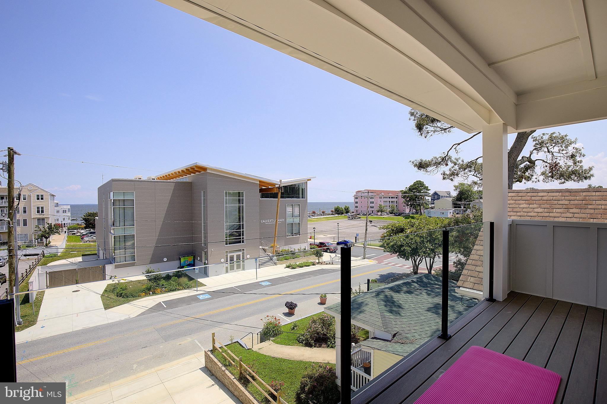 Experience the serenity of this brand-new 2-bedroom, 2-bathroom luxury bayside sanctuary located just one block from the Chesapeake Bay in the heart of North Beach. Thoughtfully designed as an organic modern retreat, this residence offers sophisticated finishes as well as water views from your living room and private front porch. Step inside to discover exquisite features and upgrades throughout, including: MSI "Taj Mahal" waterfall countertop that anchors the sleek kitchen, luxurious gold hardware, custom picture frame wall moulding, and a striking rough-cut Alamo Sandstone fireplace wall that adds warmth to your living space. Each bathroom is finished in a zen-inspired style with custom tile work, designed to reflect a modern spa-like retreat. The primary suite includes a spacious walk-in closet and a beautifully appointed en-suite bathroom. Step outside your door and you're just a block from the beach, boardwalk, restaurants, shopping, cafes, and weekend events. Enjoy the charm of North Beach with the convenience of a quick commute—30 minutes to Joint Base Andrews, 40–45 minutes to Washington, DC, Northern Virginia, and Annapolis. Tour today and discover the best of North Beach living. Broker/owner