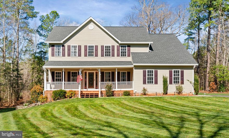 Nestled in the serene South Woods community, this spacious Colonial offers the perfect blend of privacy, comfort, and convenience. Spanning over 3,500 finished square feet on 3 levels, this home features a well planned layout that seamlessly connects living spaces, perfect for both entertaining and everyday living. Beautifully situated on a tree lined yard, the home is set back for added privacy. The long paved driveway offers plenty of parking space for multiple vehicles. The 2 car, side load garage is insulated, drywalled and painted with plenty of room for storage and includes shelving and cabinets.  Spring time is almost here and you'll notice the lush, green lawn will soon emerge at its peak. The yard has been well maintained with professional lawn treatments and service throughout the year. Inside the home you'll be pleased to find tasteful updates and value added features throughout the home. In 2021 the HVAC system was fully replaced with a new heat pump and furnace to include the duct work. In 2019 the water heater was replaced and a whole house water filter system is also installed. The electrical system was also updated and upgraded in 2021. The Roof was replaced in 2020 and also features professionally installed gutter guards. From the welcoming front porch and the custom front door you will step inside to discover a warm, yet spacious ambiance enhanced by high ceilings, natural wood floors, and recessed lighting. The kitchen, updated with white cabinetry and granite counters, equipped with newer stainless steel appliances, a serving island, and a cozy breakfast area, makes home cooking and entertaining so simple and enjoyable. Adjacent to the kitchen, the family room invites relaxation with its elegant gas fireplace, while the formal dining room and living room set the stage for memorable gatherings. For convenience the main level laundry room includes a stacked, Samsung Bespoke washer and dryer set and features recently updated flooring. Bathrooms have been updated and upgraded with custom vanities and finishes. Retreat upstairs to the primary suite with a soaring vaulted ceiling, complete with a walk-in closet and a spa-like bathroom featuring a spacious walk-in shower and luxury soaking tub and highlighted by the beautiful custom finishes. The adjacent bedroom can easily be used as a nursery or sitting room to extend into the primary suite to make a grand primary suite. An additional, spacious bedroom with a walk in closet and a full bathroom in the hallway round out the upper level living area. The finished basement features another bedroom or a flex space for possible home office and a full bath providing ample room for guests or work from home lifestyles. The large recreation room is a versatile space that features a closet and a separate entrance to walk out to the backyard. In addition the basement offers plenty of storage space in the unfinished utility room. It could be a perfect space for a workshop. Outside, the property boasts a beautifully landscaped 1 acre lot, with wooded views offering a private oasis. Enjoy outdoor living on the rear deck or front porch, perfect for morning coffee or evening gatherings. The back deck features a screened gazebo for relaxing and entertaining in comfort. The community amenities, including a pool, tot lot, tennis/basketball courts, and a club house enhance the exclusive lifestyle this home provides. South Woods is conveniently located just minutes away from schools, shopping, and commuting options. I-95 and the VRE are just a few miles away. Experience the perfect blend of luxury, comfort, and community in this wonderful home. Schedule your showing appointment today!